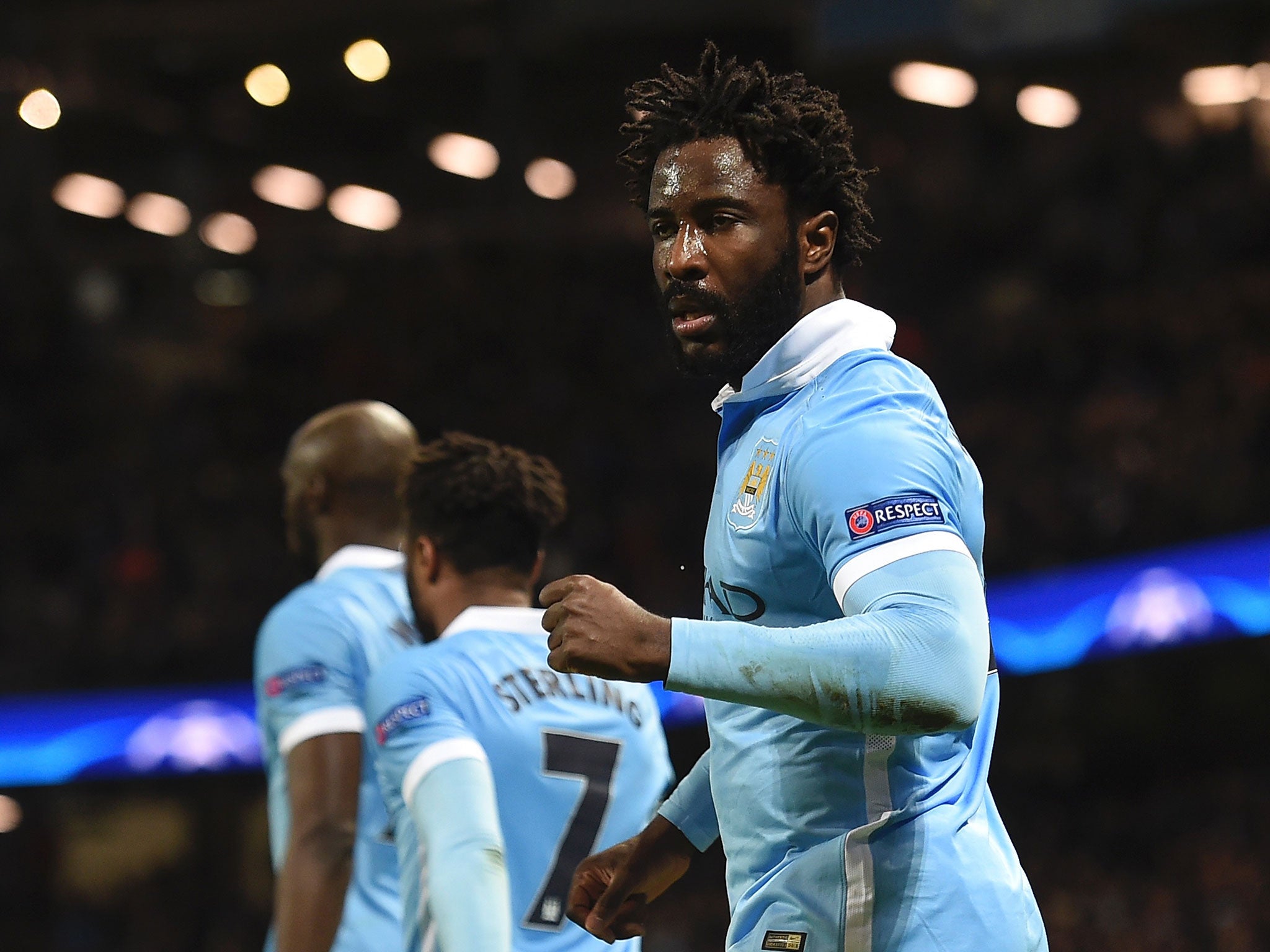 Manchester City's Ivorian striker Wilfried Bony (R) celebrates scoring their fourth goal