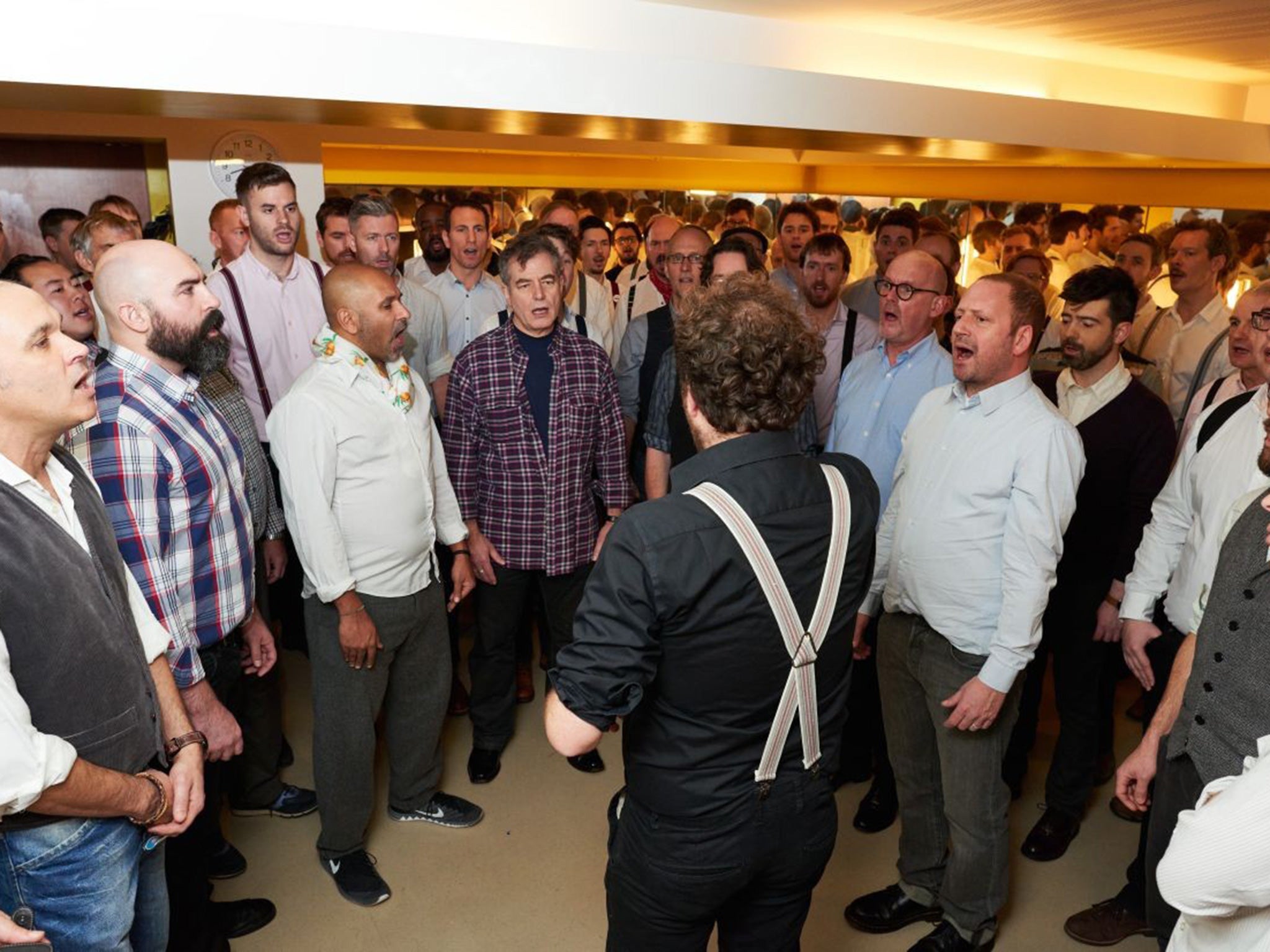 Sing for your succour: Simmy Richman (front right) rehearses with the Chaps Choir