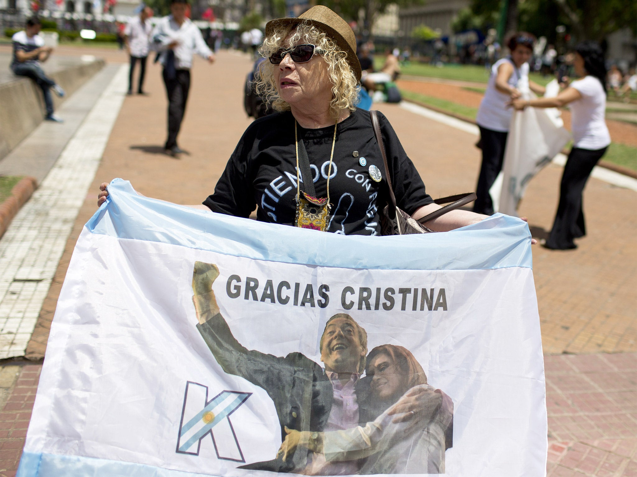 A government supporter pays tribute to President Cristina Fernandez de Kirchner and her husband, the late President Nestor Kirchner, in Buenos Aires