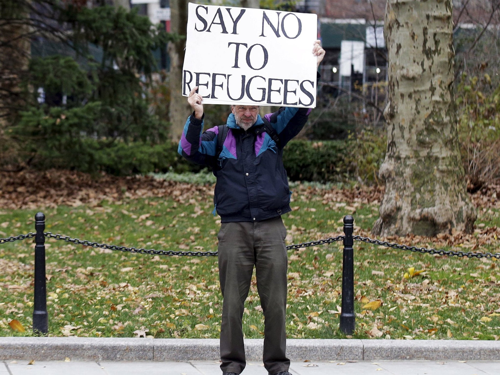 A supporter of US Republican presidential candidate Donald Trump stands close to an interfaith rally at New York’s City Hall