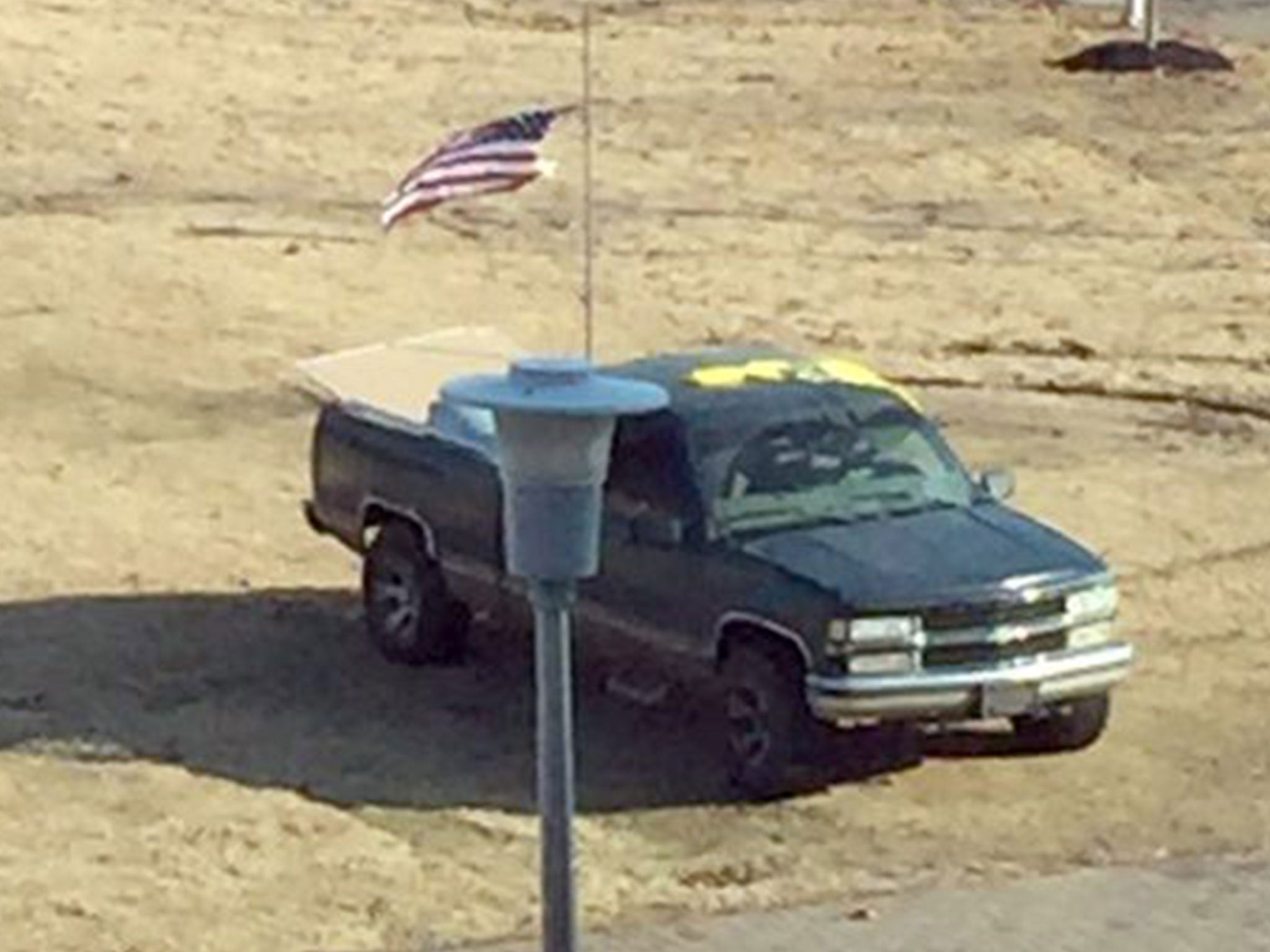 Truck is parked on the lawn in front of the student union at Arkansas State University