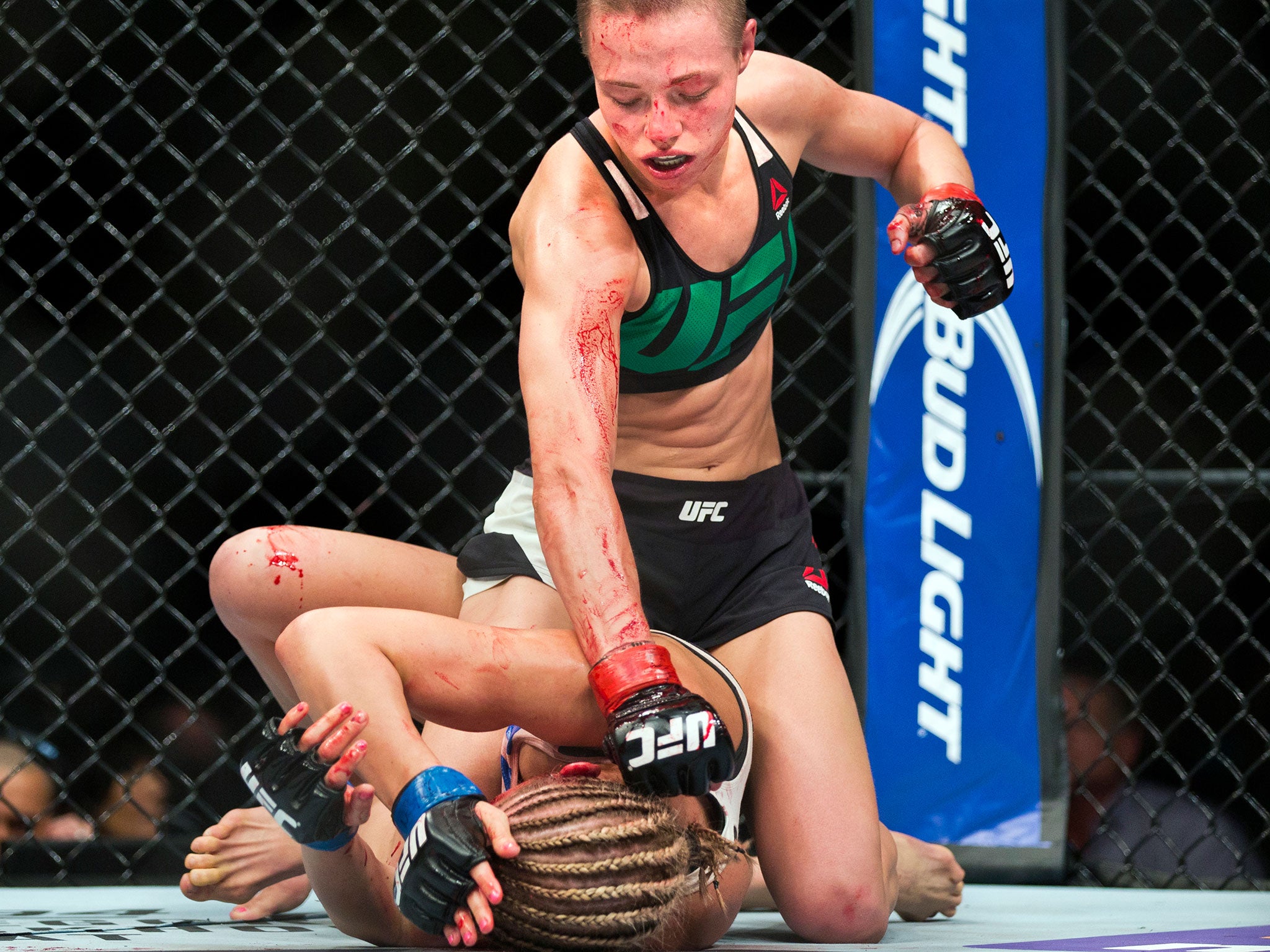 Rose Namajunas unleashes a flurry of punches on Paige VanZant