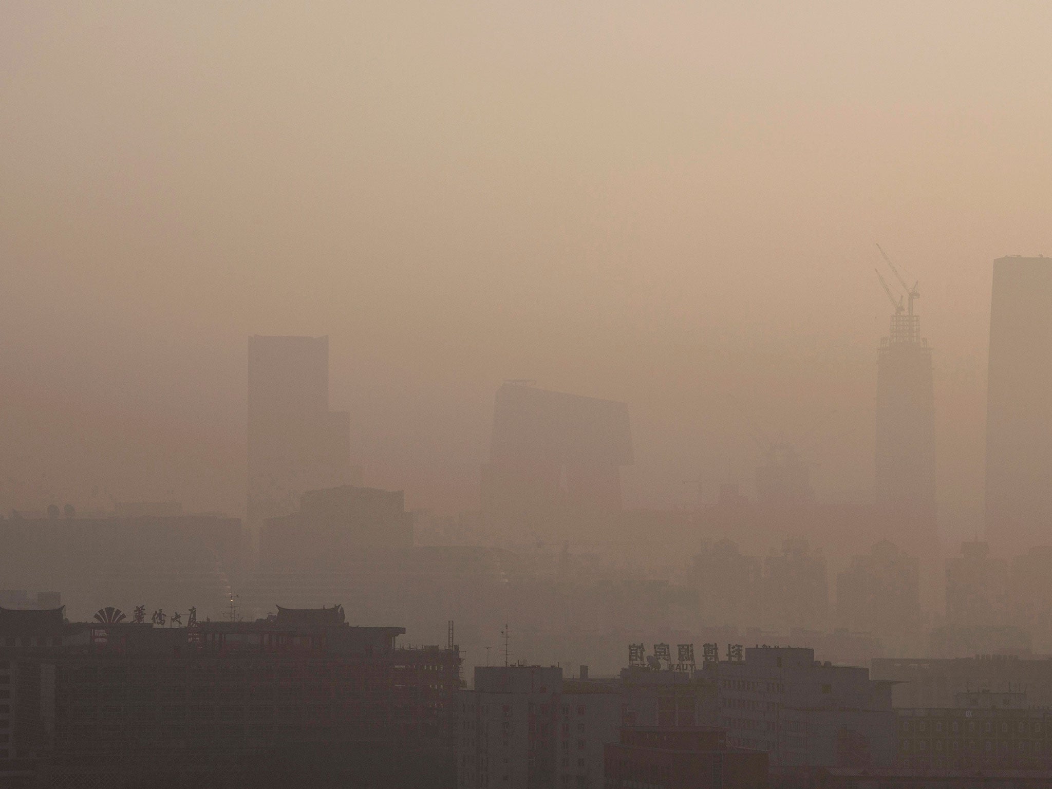 The skyline of the city could be seen under severe smog on December 10, 2015, in Beijing