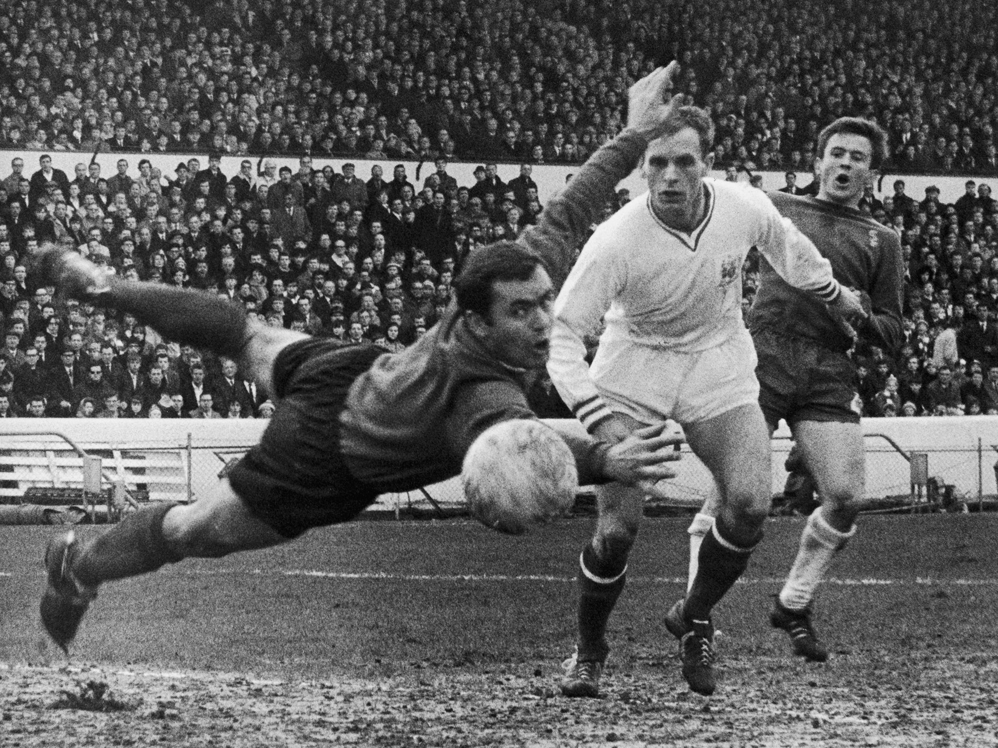 Sheffield United keeper Alan Hodgkinson (left) tips a shot, which hit the post and went for a corner, during an FA Cup 5th round match against Chelsea during a match at Stamford Bridge, London,