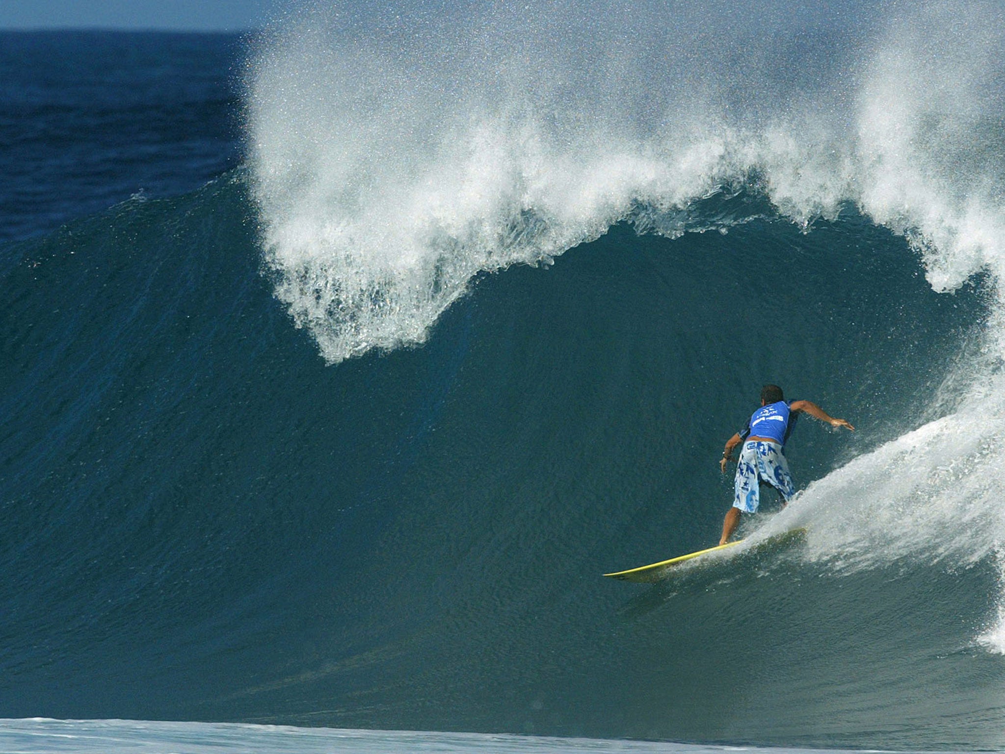 A surfer pictured at Banzai Pipeline