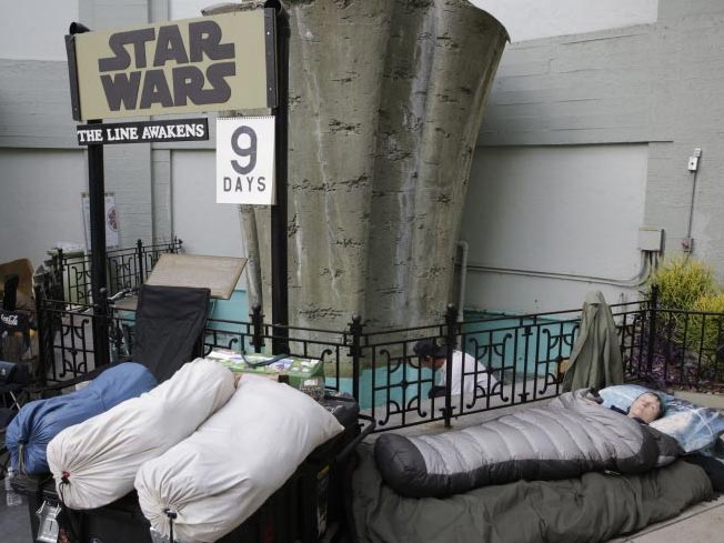 Caroline Ritter sleeps while waiting first in line for a chance to see The Force Awakens. She is planning to get married before the premiere of the film.