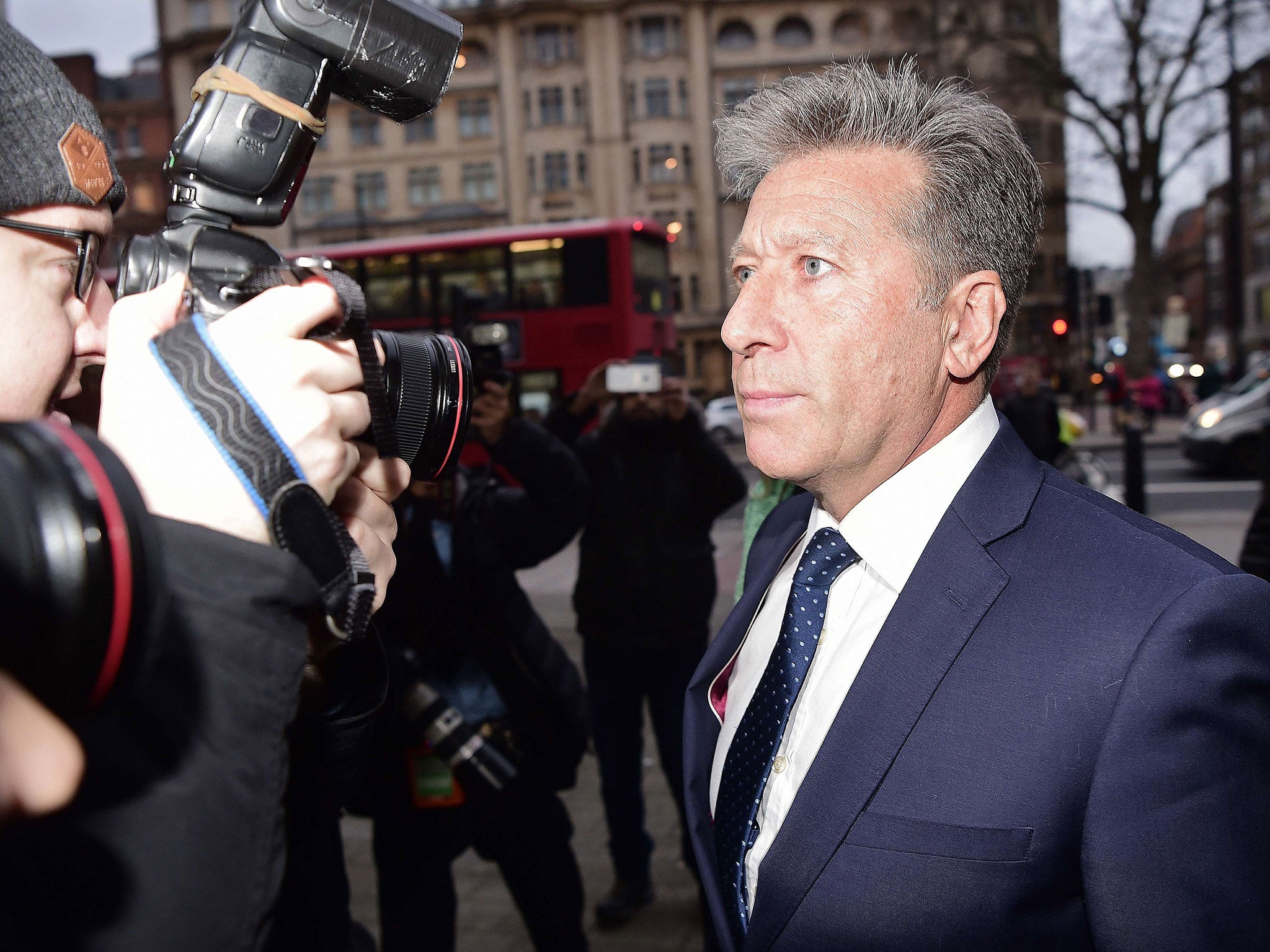 Former British DJ Neil Fox (R) arrives at Westminster Magistrates Court in central London on December 14, 2015