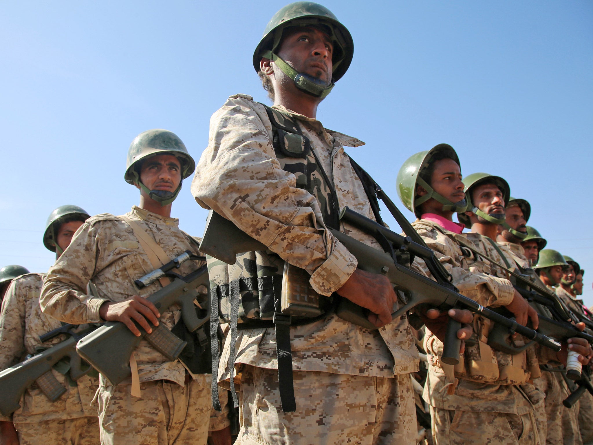 Yemeni troops loyal to their Saudi-backed President Abedrabbo Mansour Hadi march during a parade military west of the city of Marib