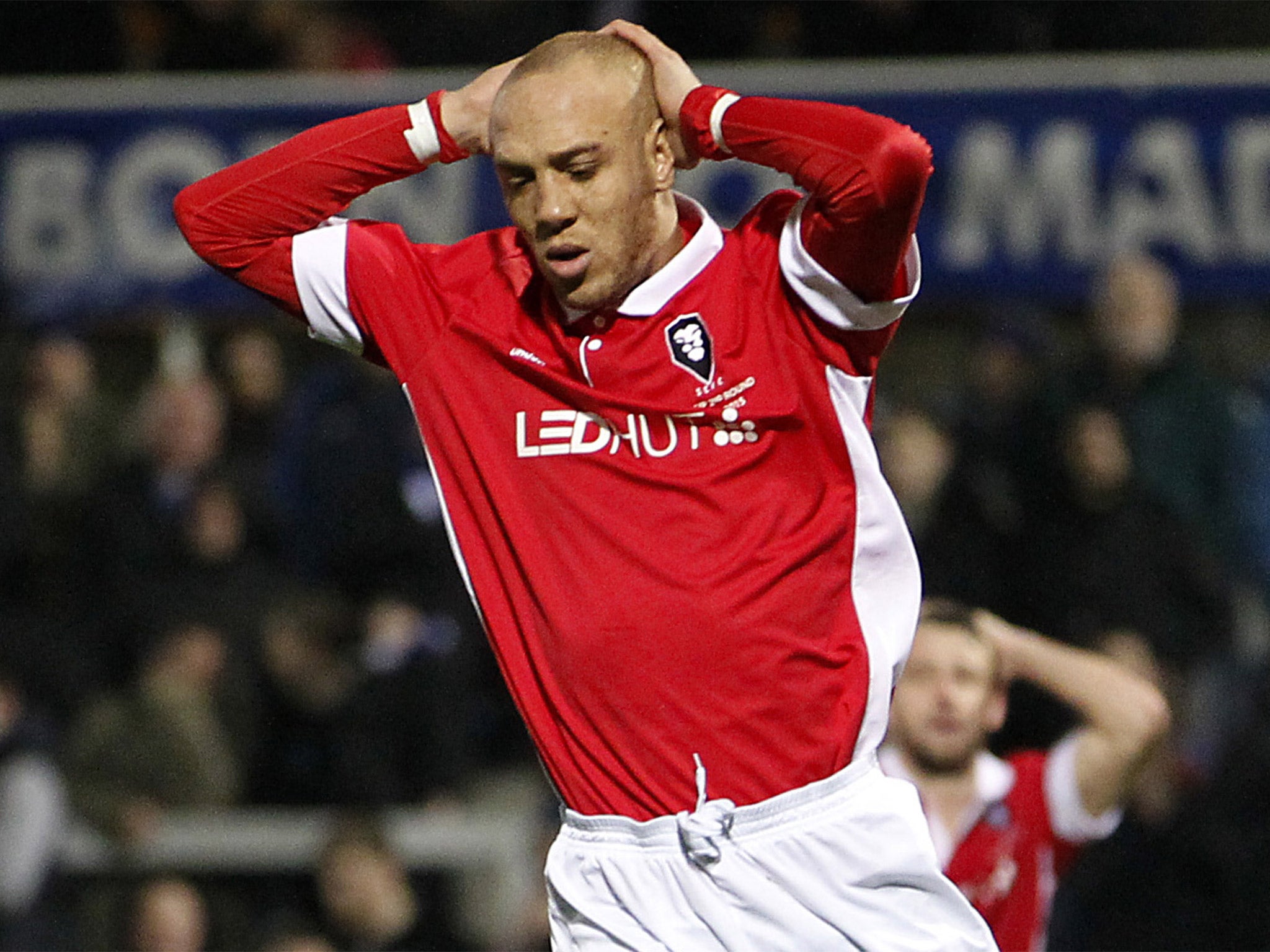 Salford’s Richie Allen reacts after hitting a post