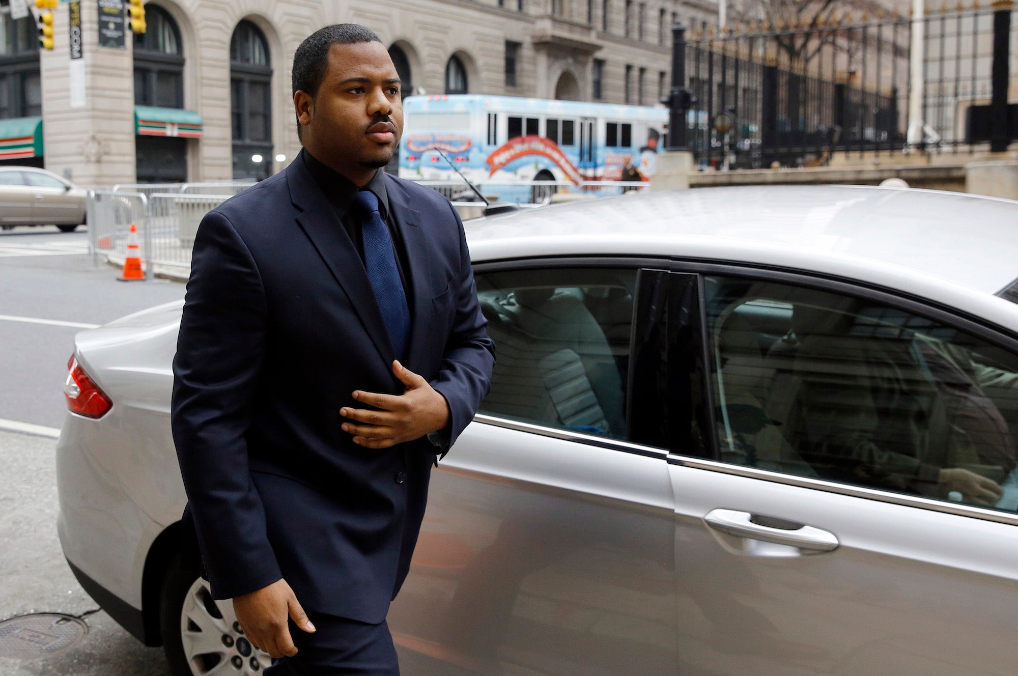 William Porter walks into a courthouse during jury deliberations.