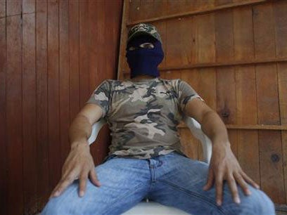 The man claiming to be responsible for kidnapping, torture and killing on behalf of a drug cartel speaks to the Associated Press in Guerrero state's Costa Grande region