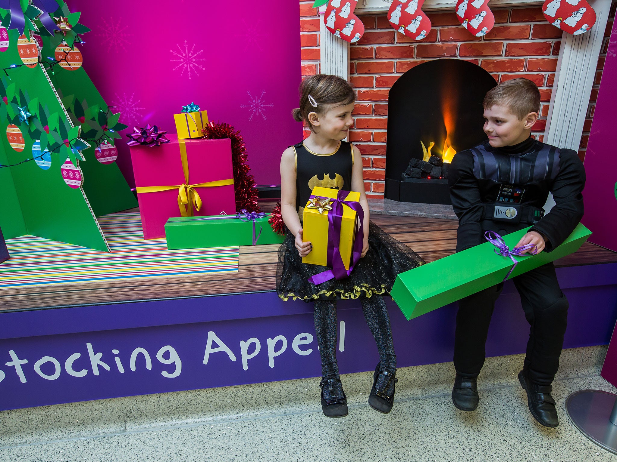 Freddie and Thierry Nicholson at the hospital’s mock fireplace