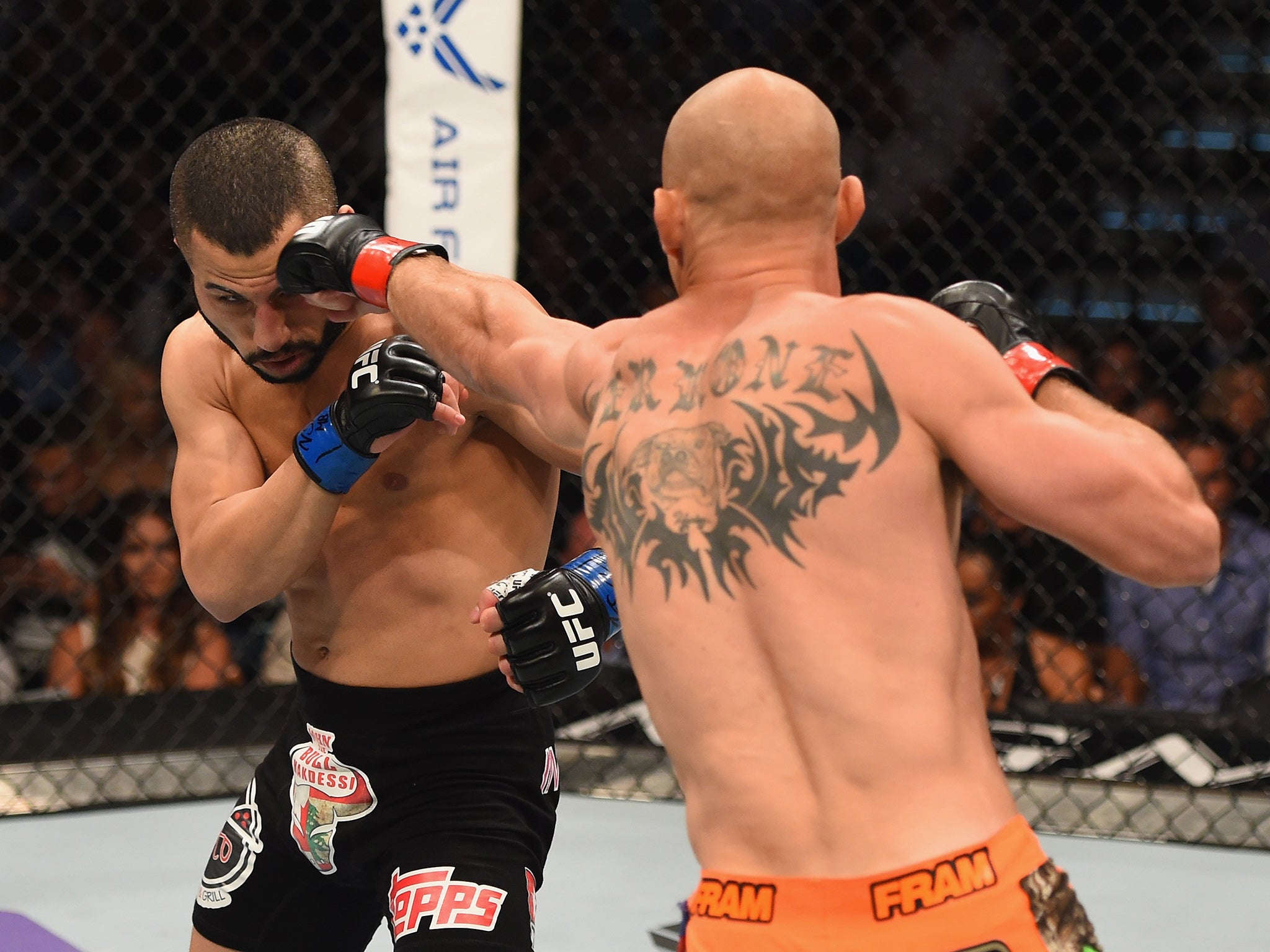 
Donald Cerrone punches John Makdessi