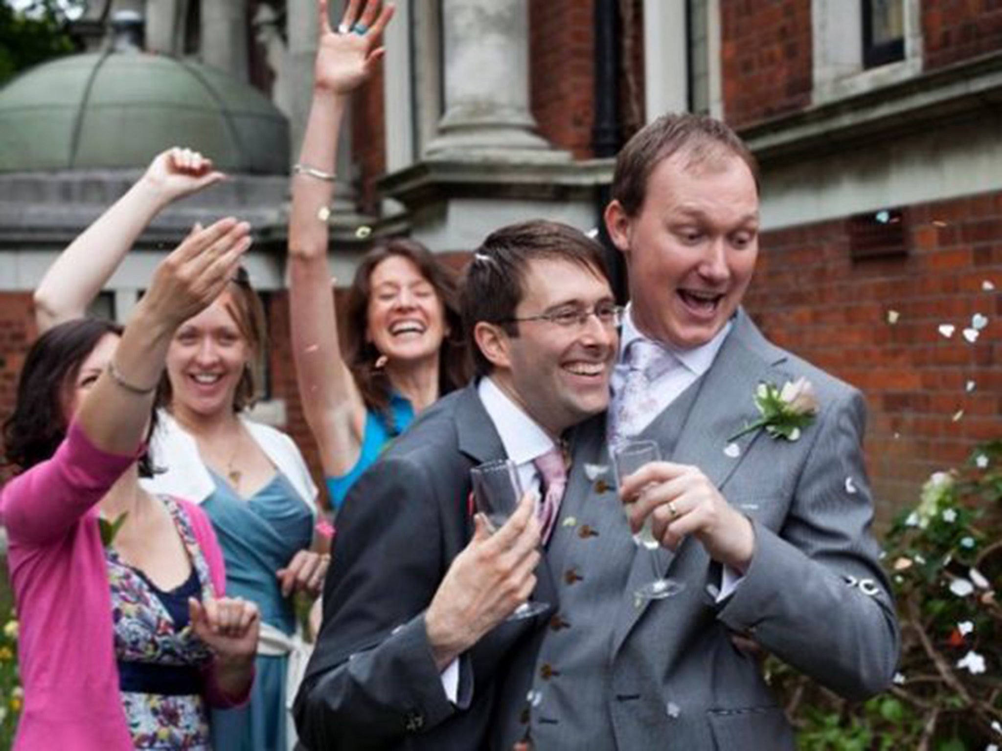 Danny Whitby and Myles Stinton (far right) at their civil partnership