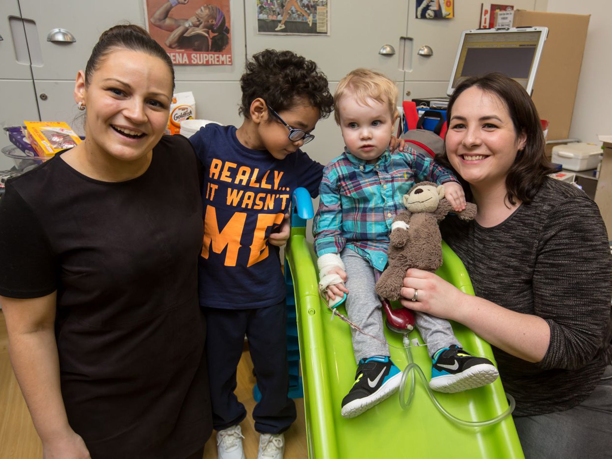 Home from home: Joanne (left), son Marley, Elliott and his mum, Candace