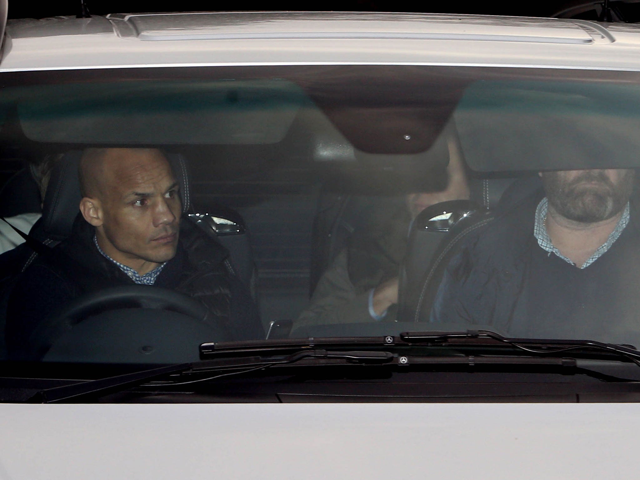 Chelsea owner Roman Abramovich (back-seat, partially obscured) leaves the club's Cobham training base