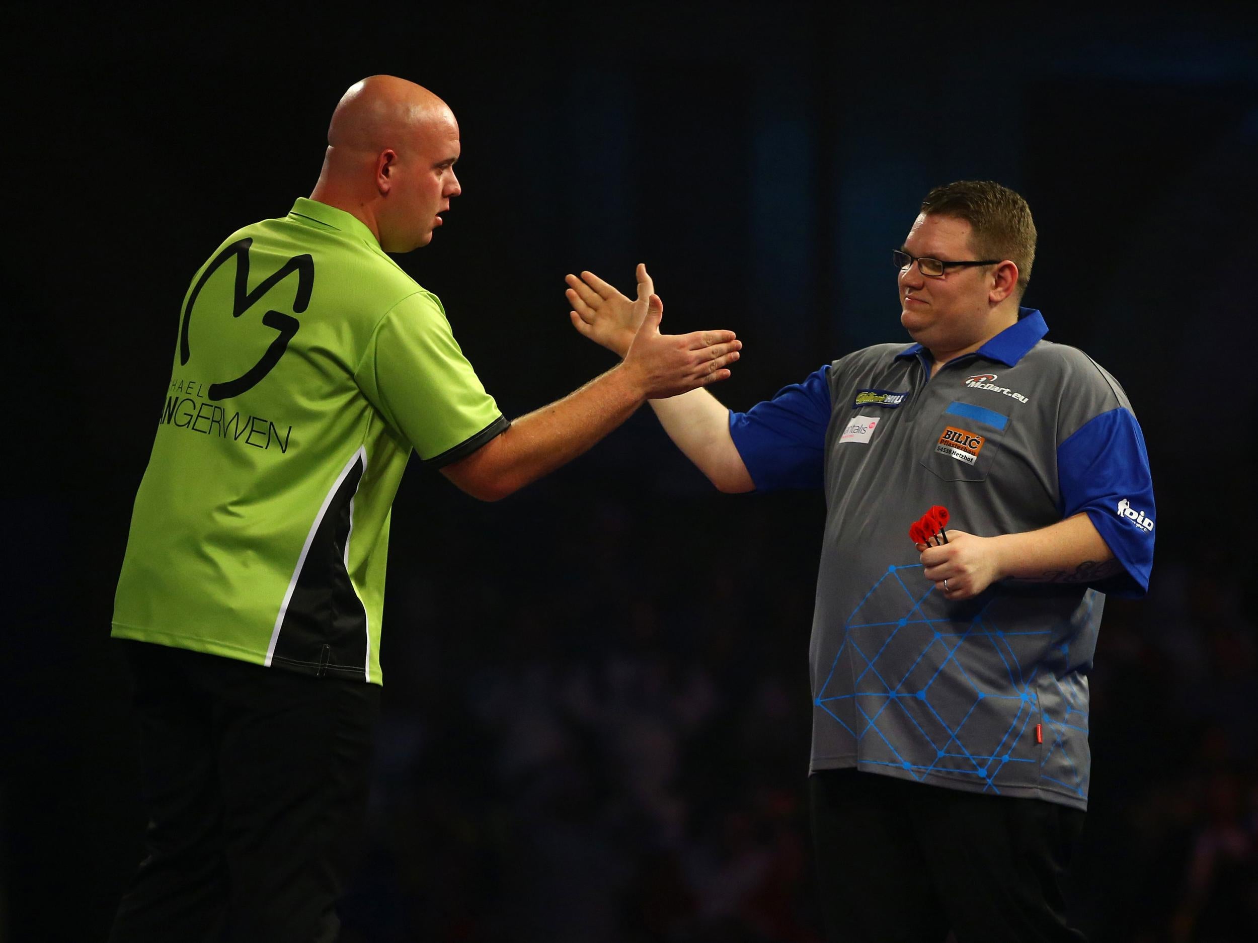 Michael van Gerwen congratulates Rene Eidams after pushing him close in the first round