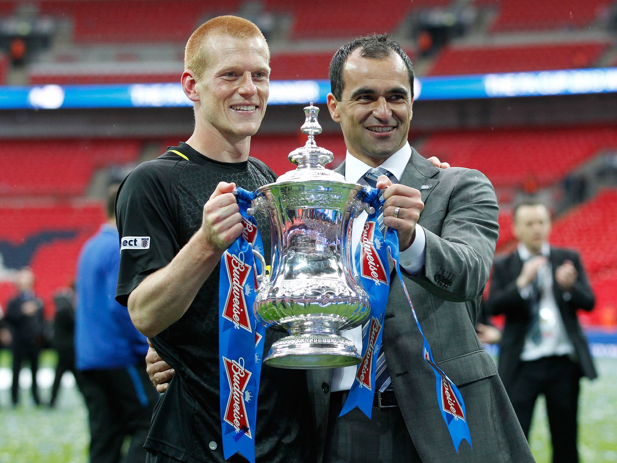 Watson celebrates Wigan's FA Cup victory with Roberto Martinez