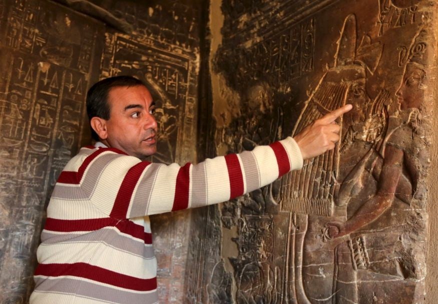 French archaeologist Alain Zivie showing journalists the carvings on Maya's tomb