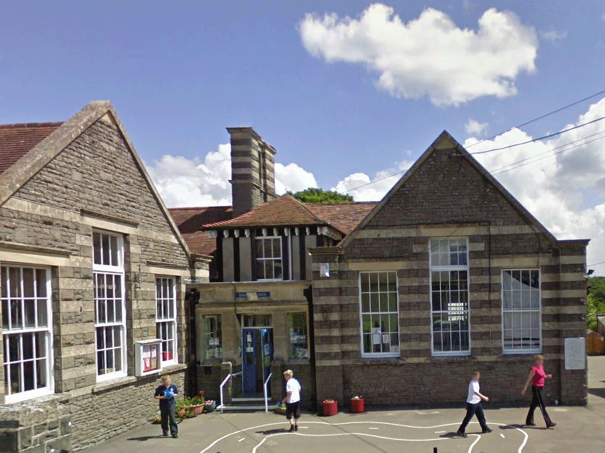 Parents at Somerset primary school are scolded for letting their children urinate in their playground at the end of school day