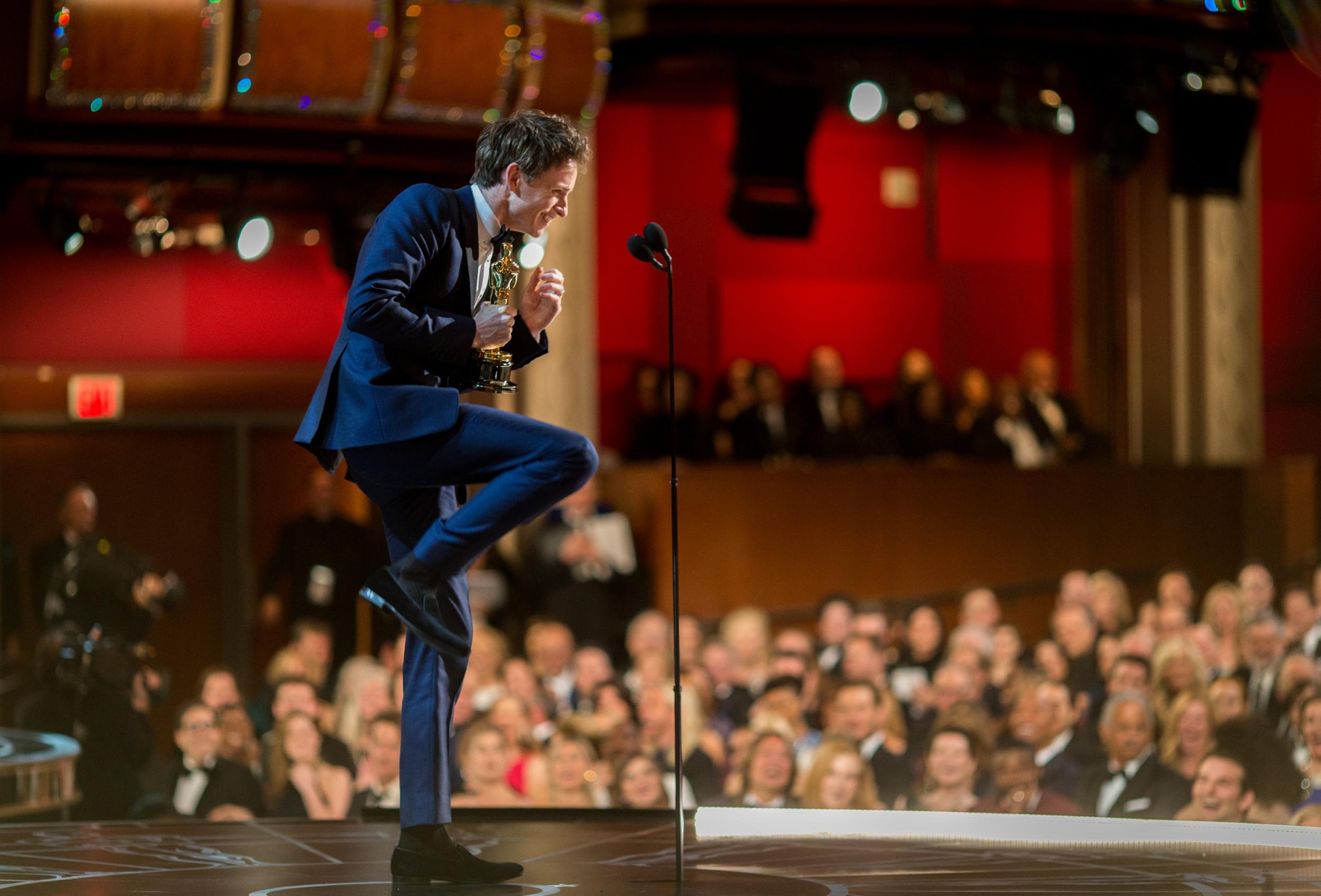 Eddie Redmayne speaks onstage after winning his award for best Actor in a Leading Role