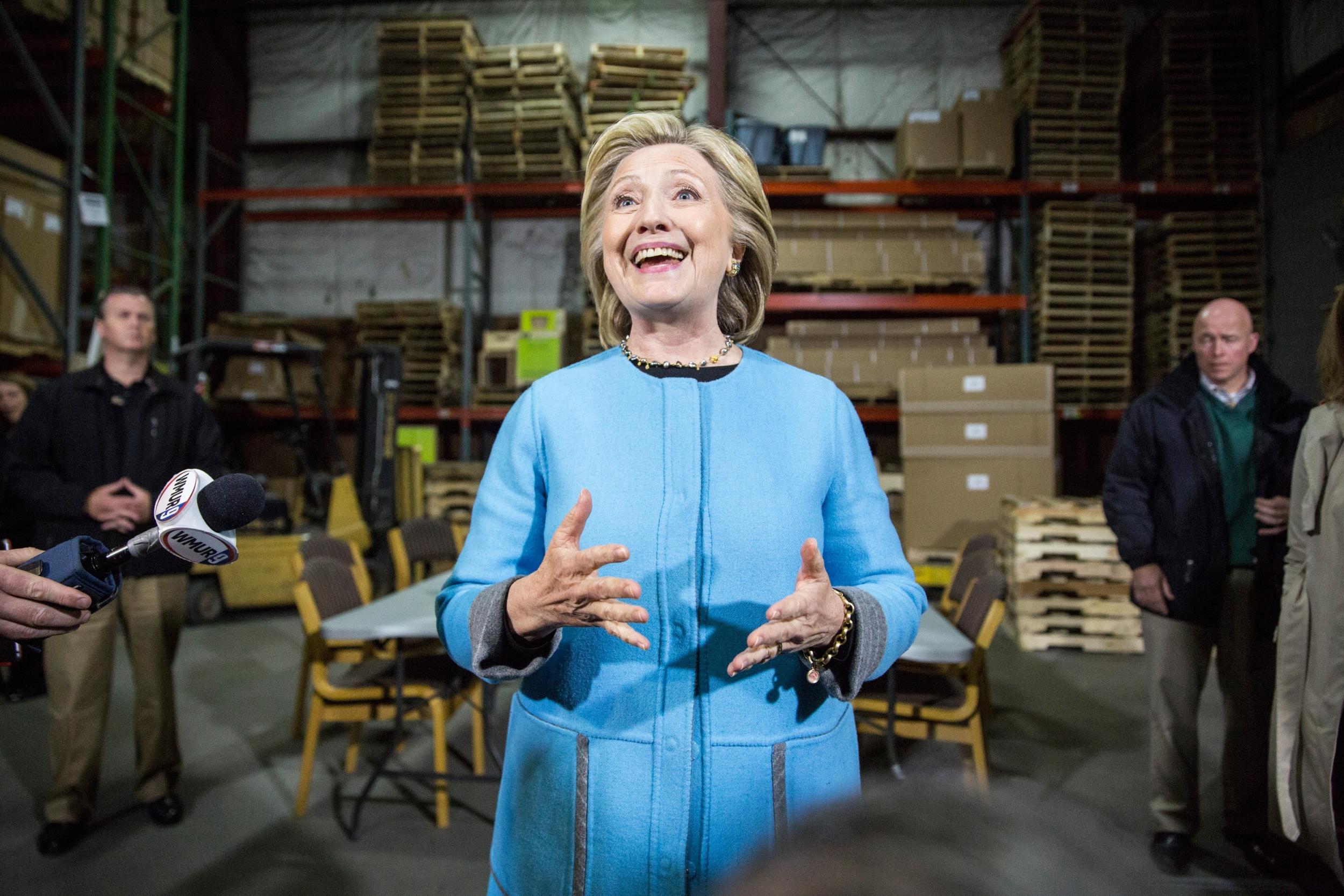 Hillary Clinton speaks with members of the media