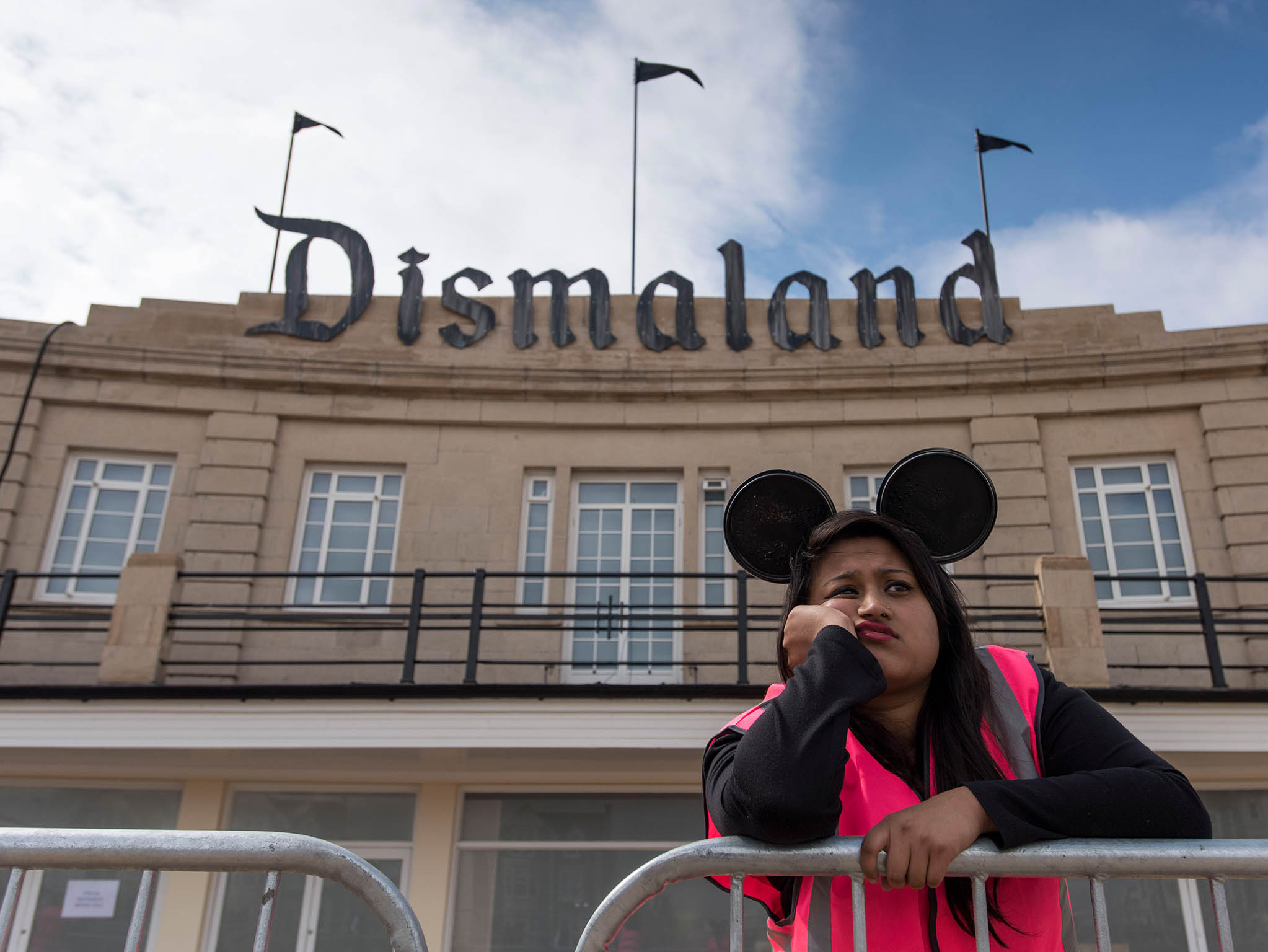 A steward is seen outside Banksy's 'Dismaland' exhibition