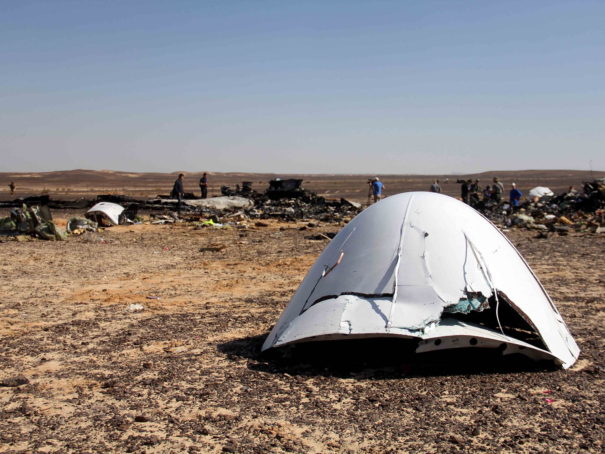 debris of a Russian airplane is seen at the site a day after the passenger jet bound for St. Petersburg, Russia, crashed in Hassana, Egypt