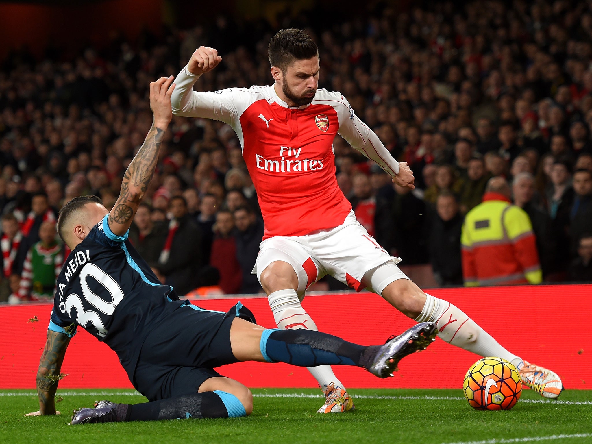 Nicolas Otamendi attempts to tackle Olivier Giroud