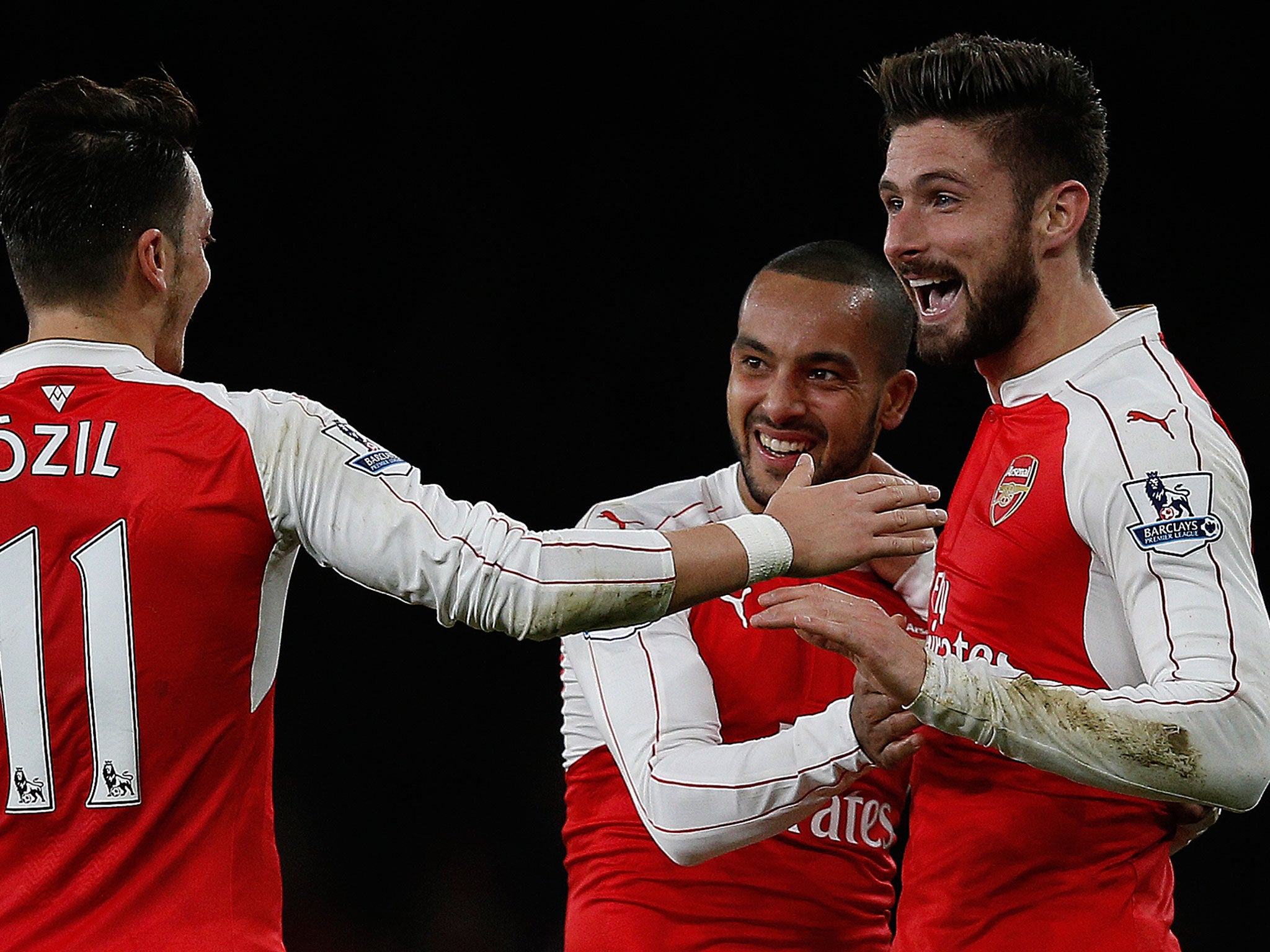 Olivier Giroud celebrates his goal with Theo Walcott and Mesut Ozil