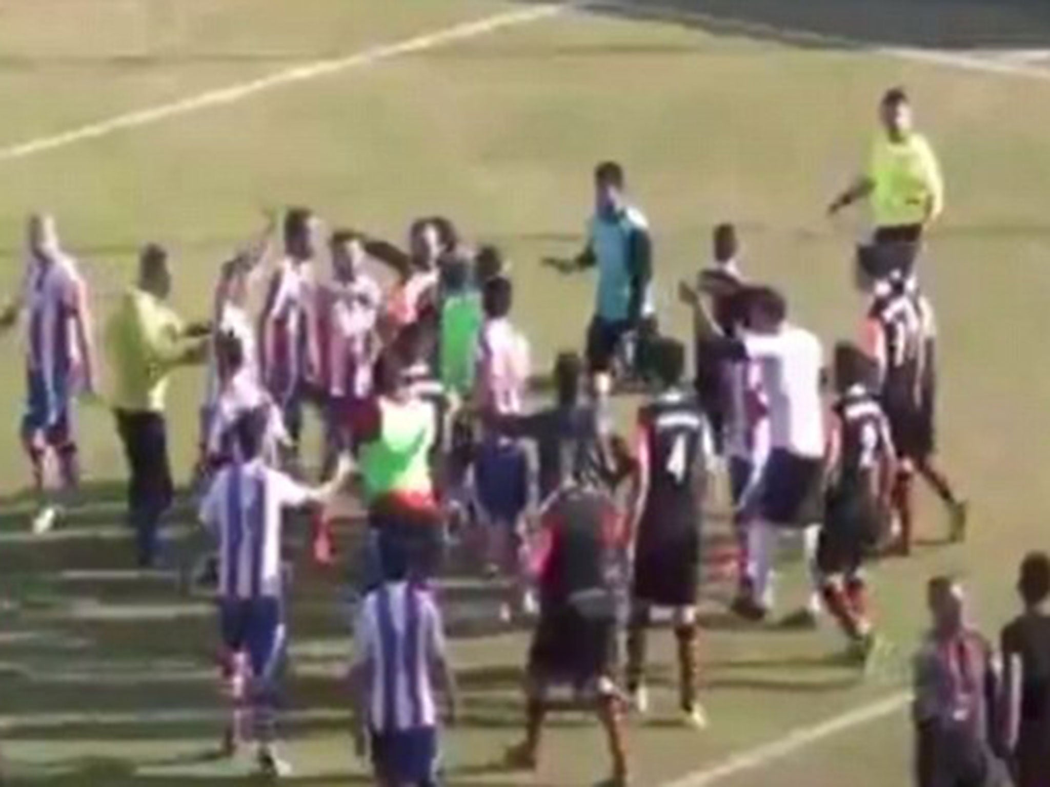 &#13;
Dallicaspor players confront Degirmenci, who runs off the pitch and down the tunnel&#13;