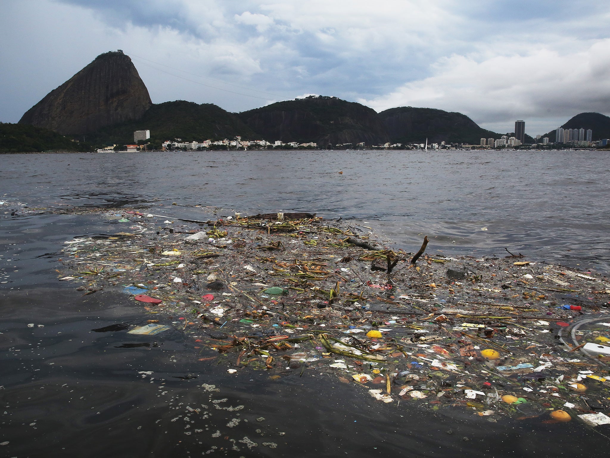 The 147-square-mile Guanabara Bay is inundated with raw sewage and tons of rubbish every day from low-income communities around it