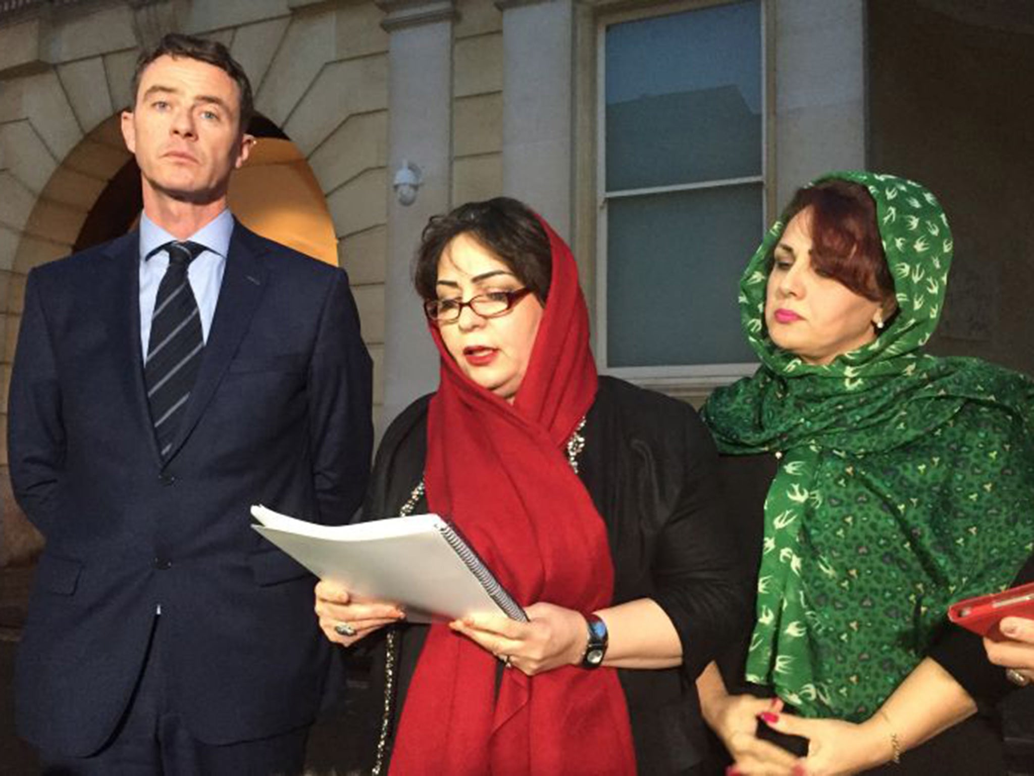 Bijan Ebrahimi's sisters Manizhah Moore (centre) and Ladin Ebrahimi make a statement outside Bristol Crown Court