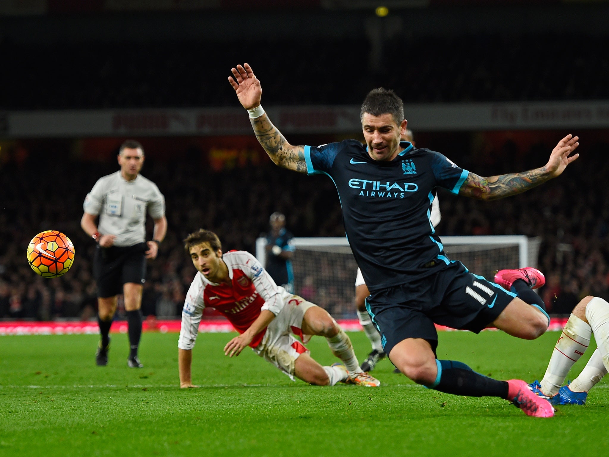 Aleksandar Kolarov takes a forlorn tumble at the Emirate
