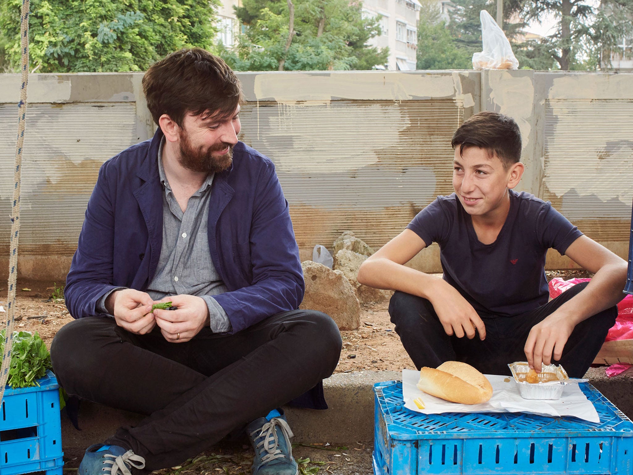 Stevie Parle, left, joins a local to sample some of Istabul's street food