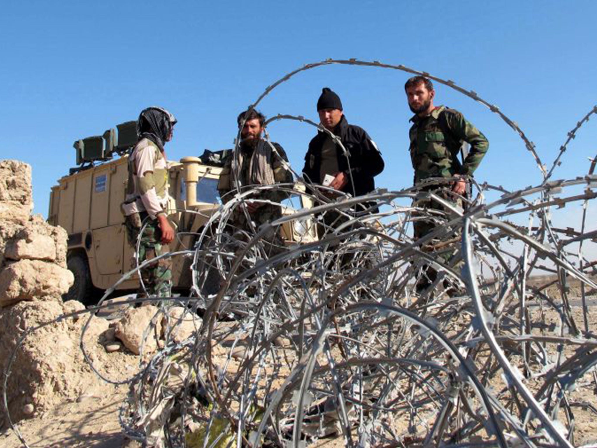 Afghan security forces patrolling Helmand province , where at least 90 of their colleagues have been killed in the past two days during heavy fighting with the Taliban