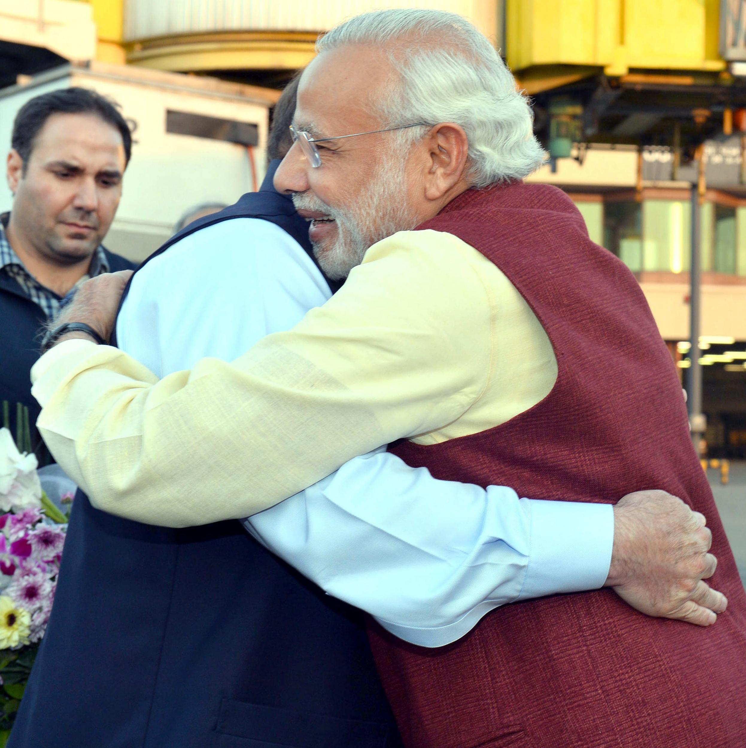 Mr Modi hugs his Pakistani counterpart as he arrives in Lahore