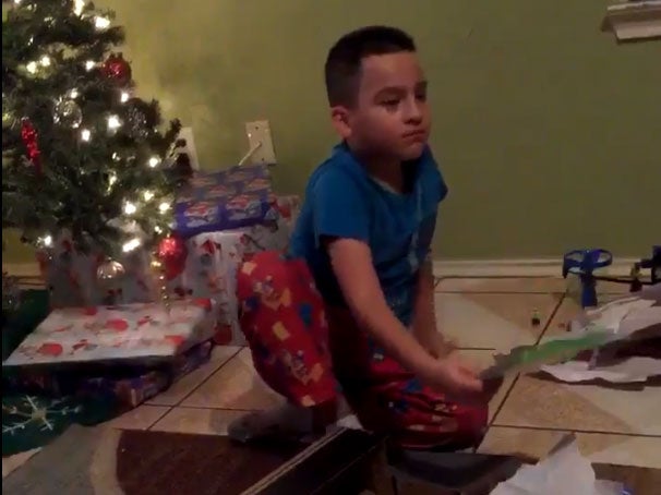 The young boy after realising he got the wrong present