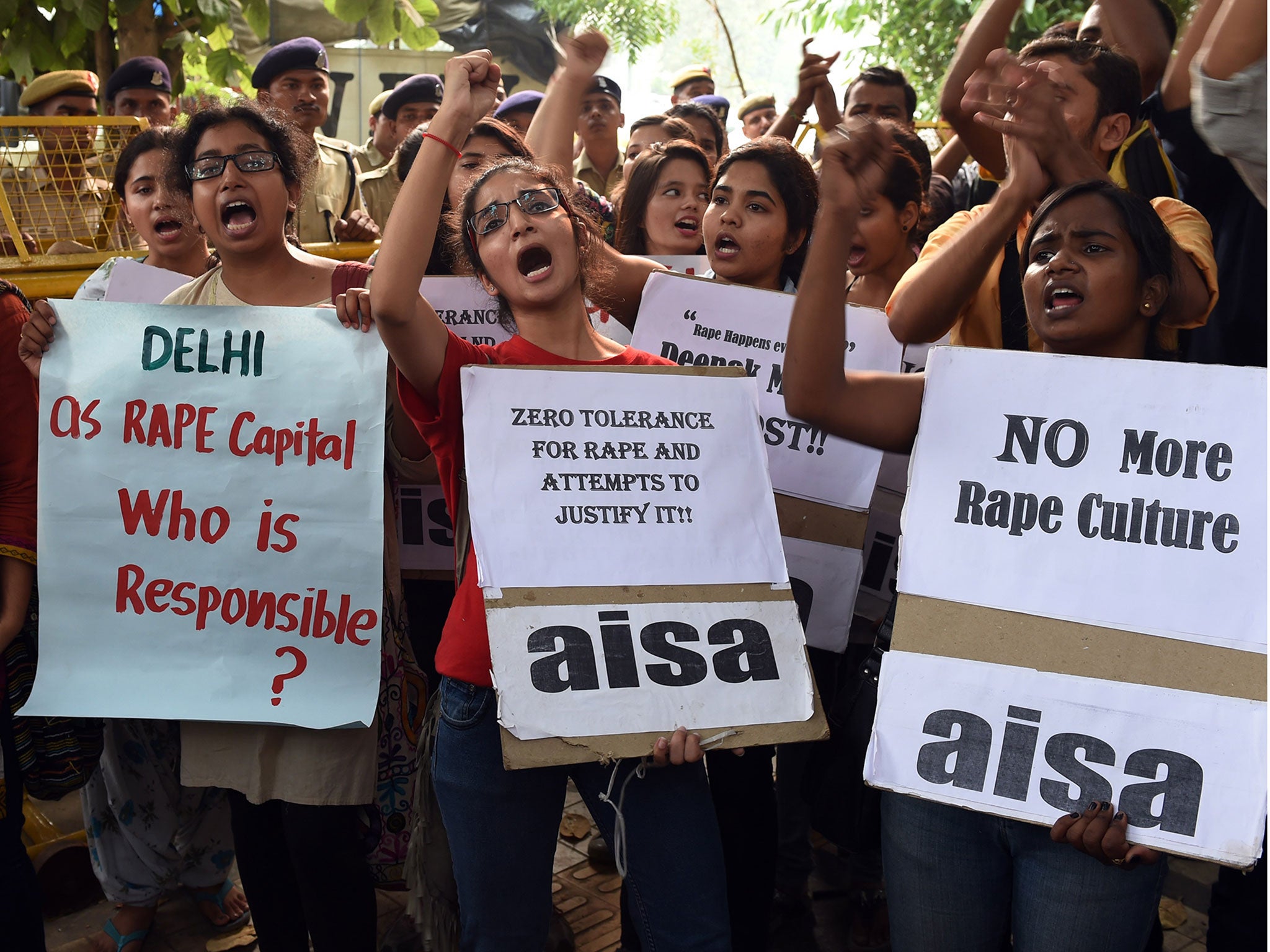 Indian students protest against the rapes of two minor girls outside the police headquarters in New Delhi in October