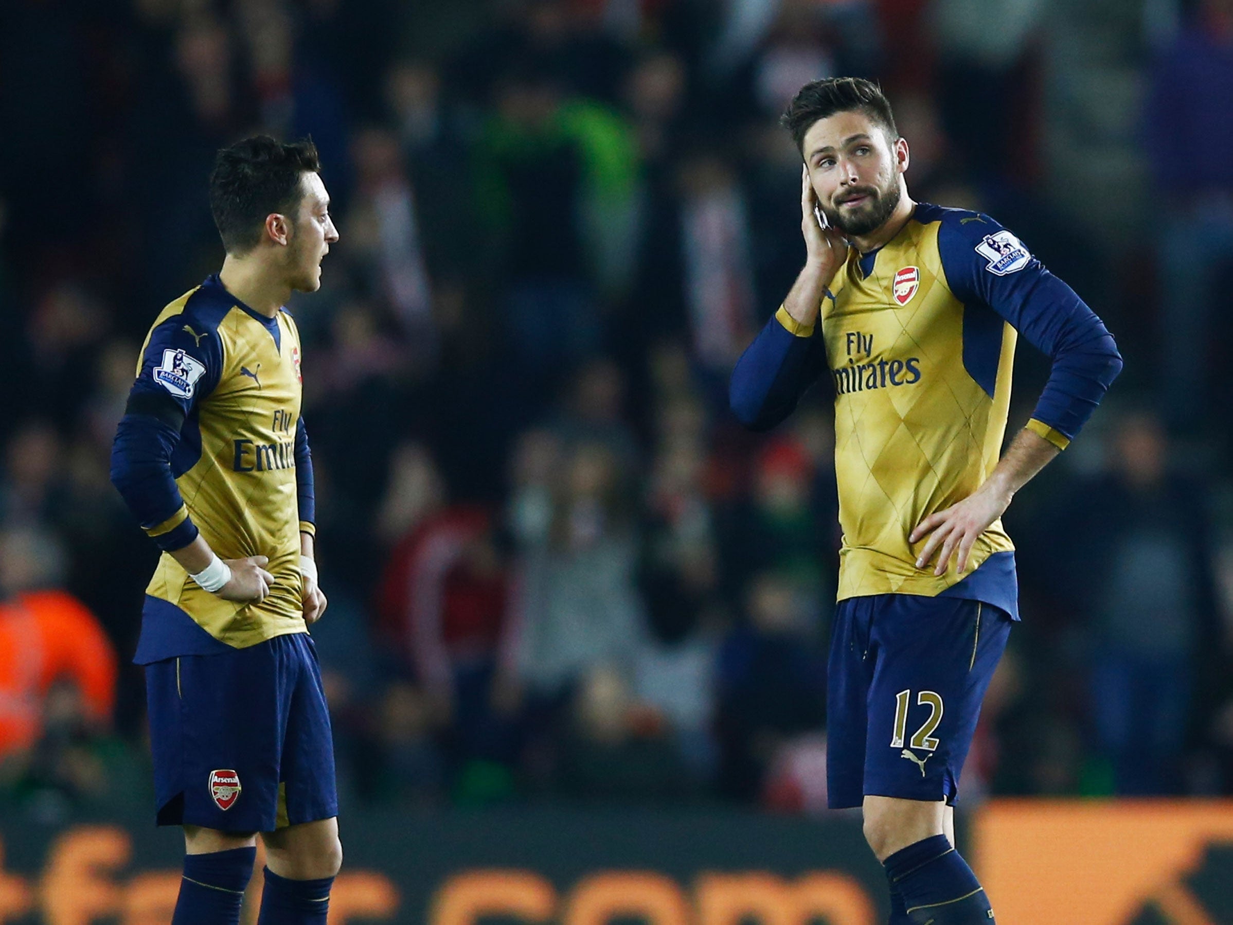 Arsenal players Mesut Ozil and Olivier Giroud