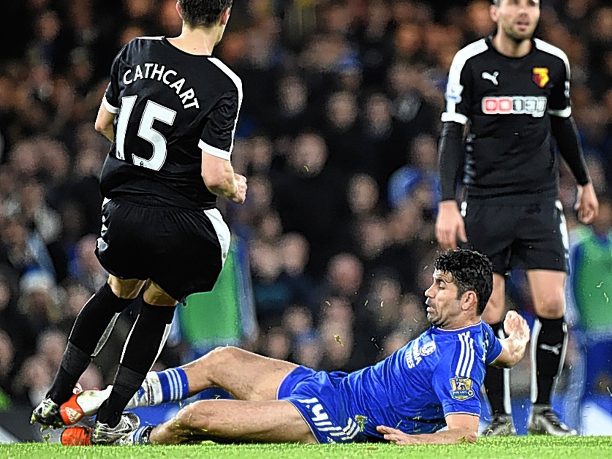 Diego Costa fouls Craig Cathcart, of Watford, during Saturday’s 2-2 draw