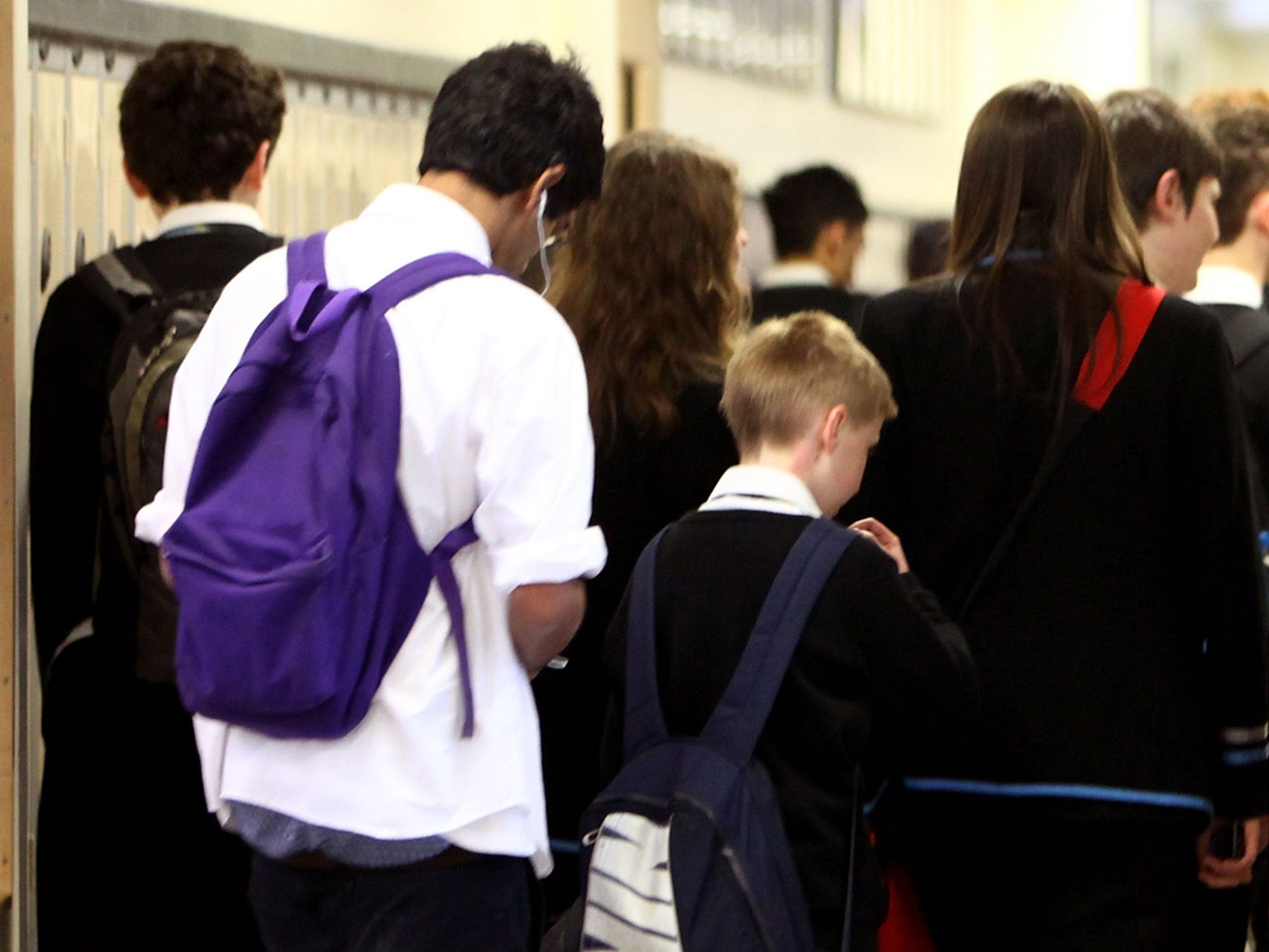 Pupils at Williamwood High School make their way to classes