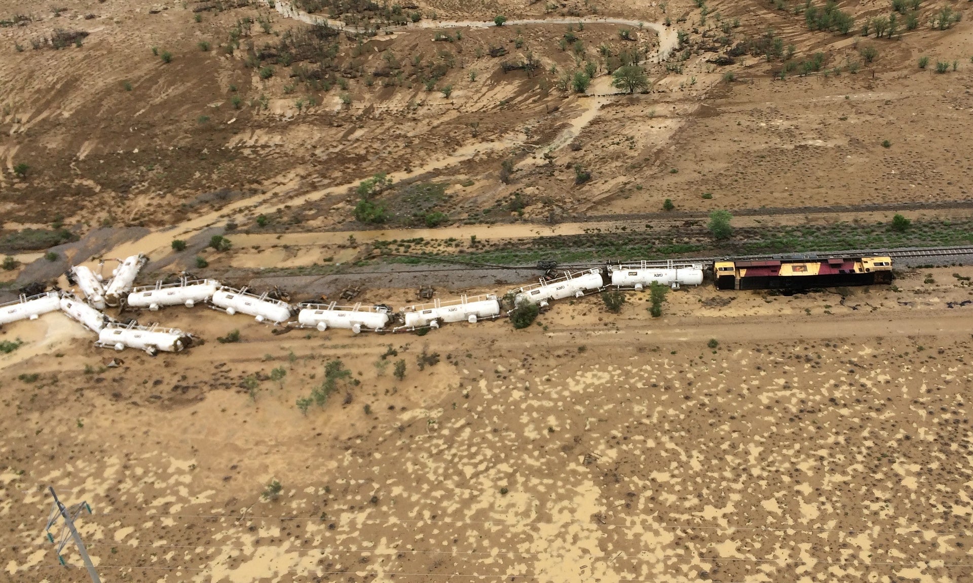 A locomotive and all 26 carriages were derailed in Queensland, Australia