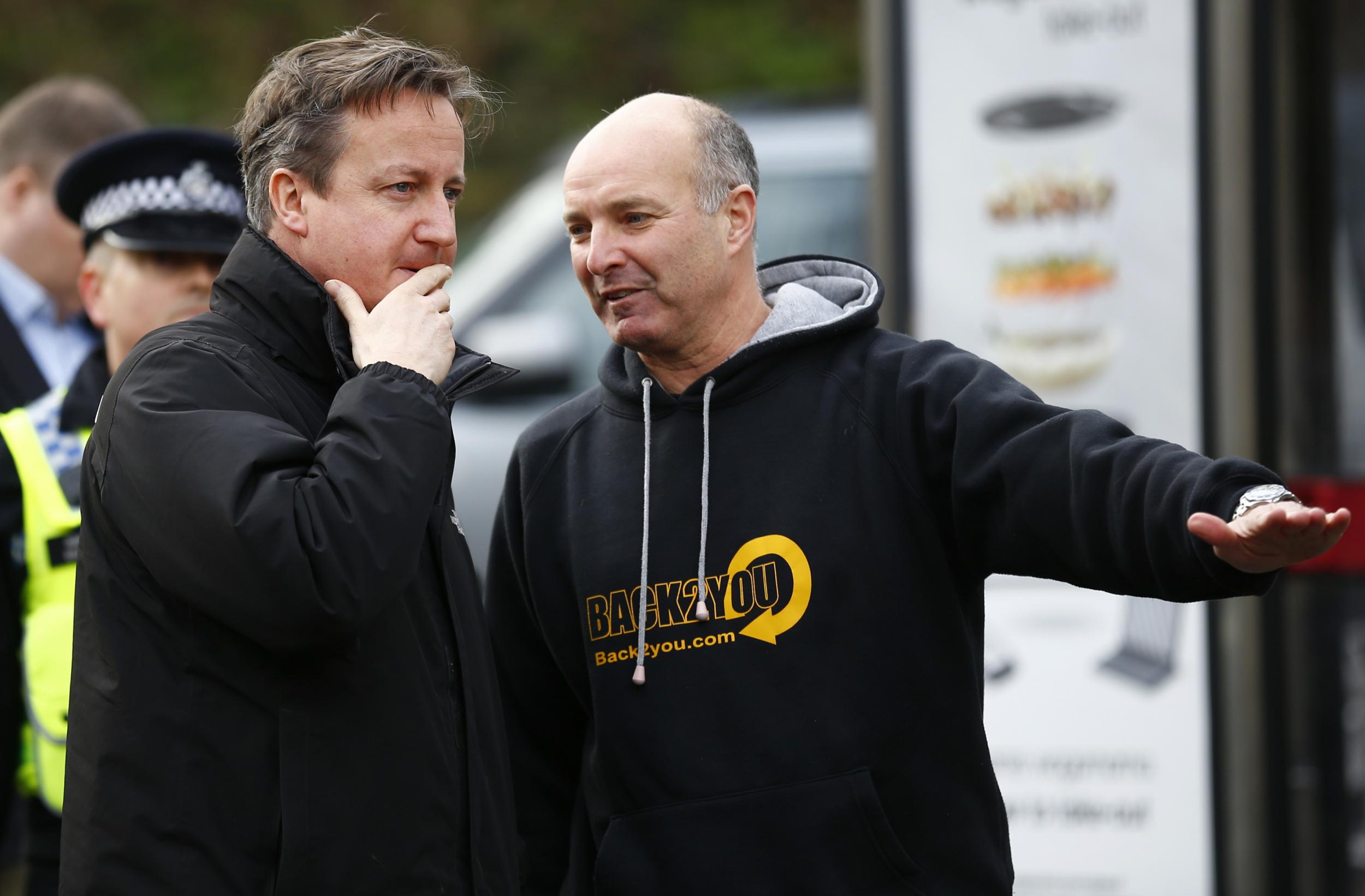 David Cameron meets volunteers at a sandbagging centre in York after the city was devastated by flooding