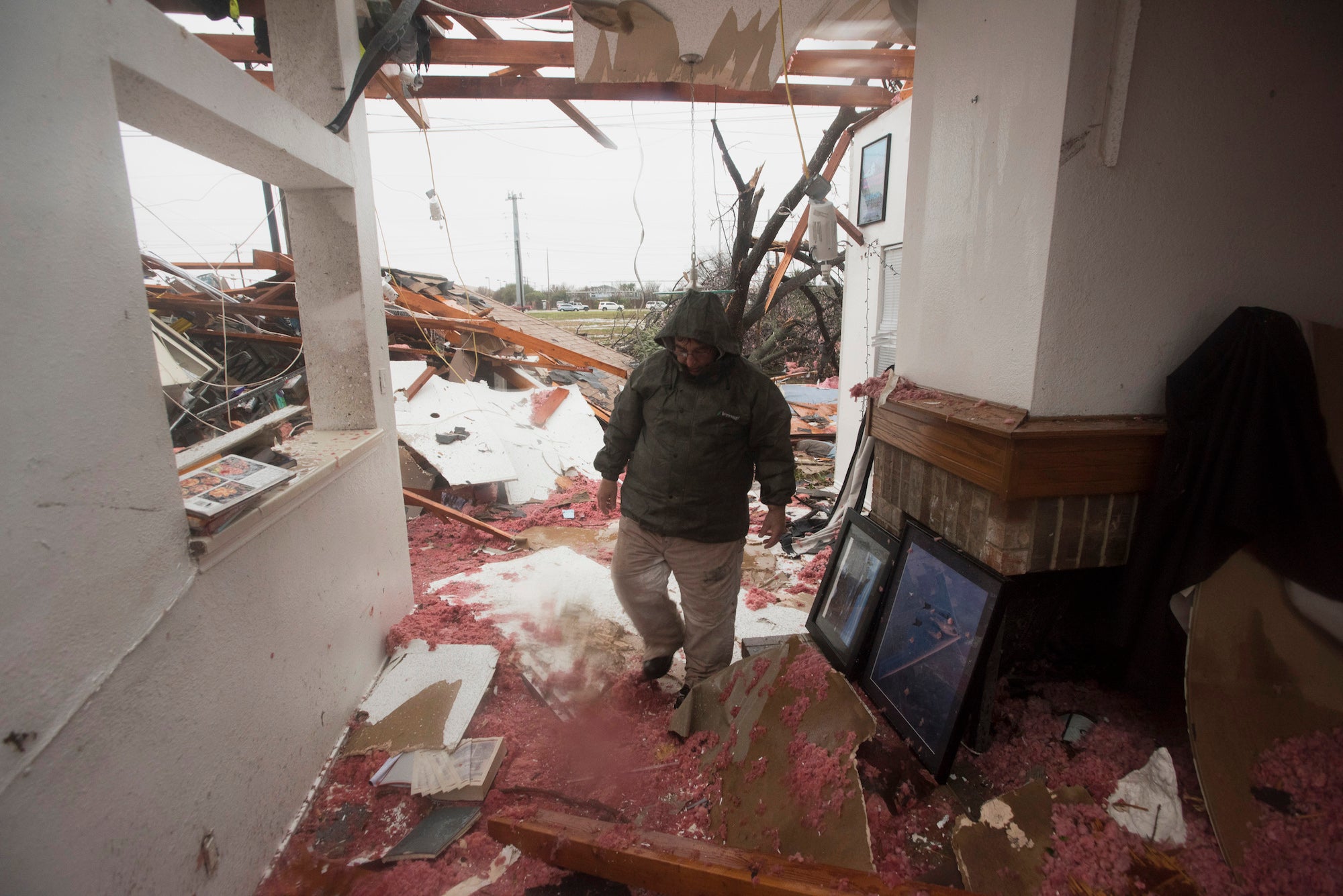 Bob Moore walks through his home in Rowlett, Texas on December 27, 2015, the morning after it was struck by a tornado.