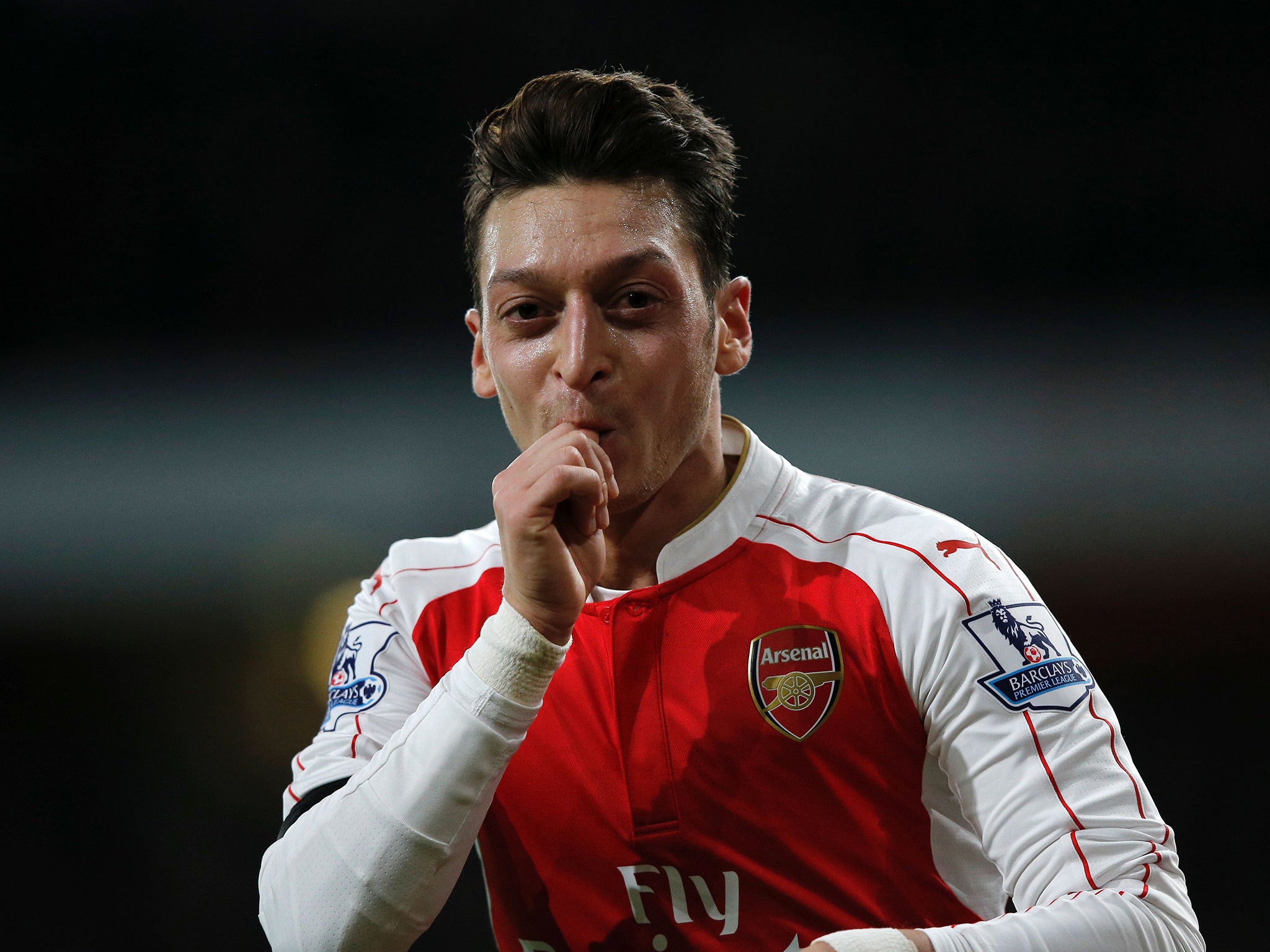 Mesut Ozil celebrates making it 2-0