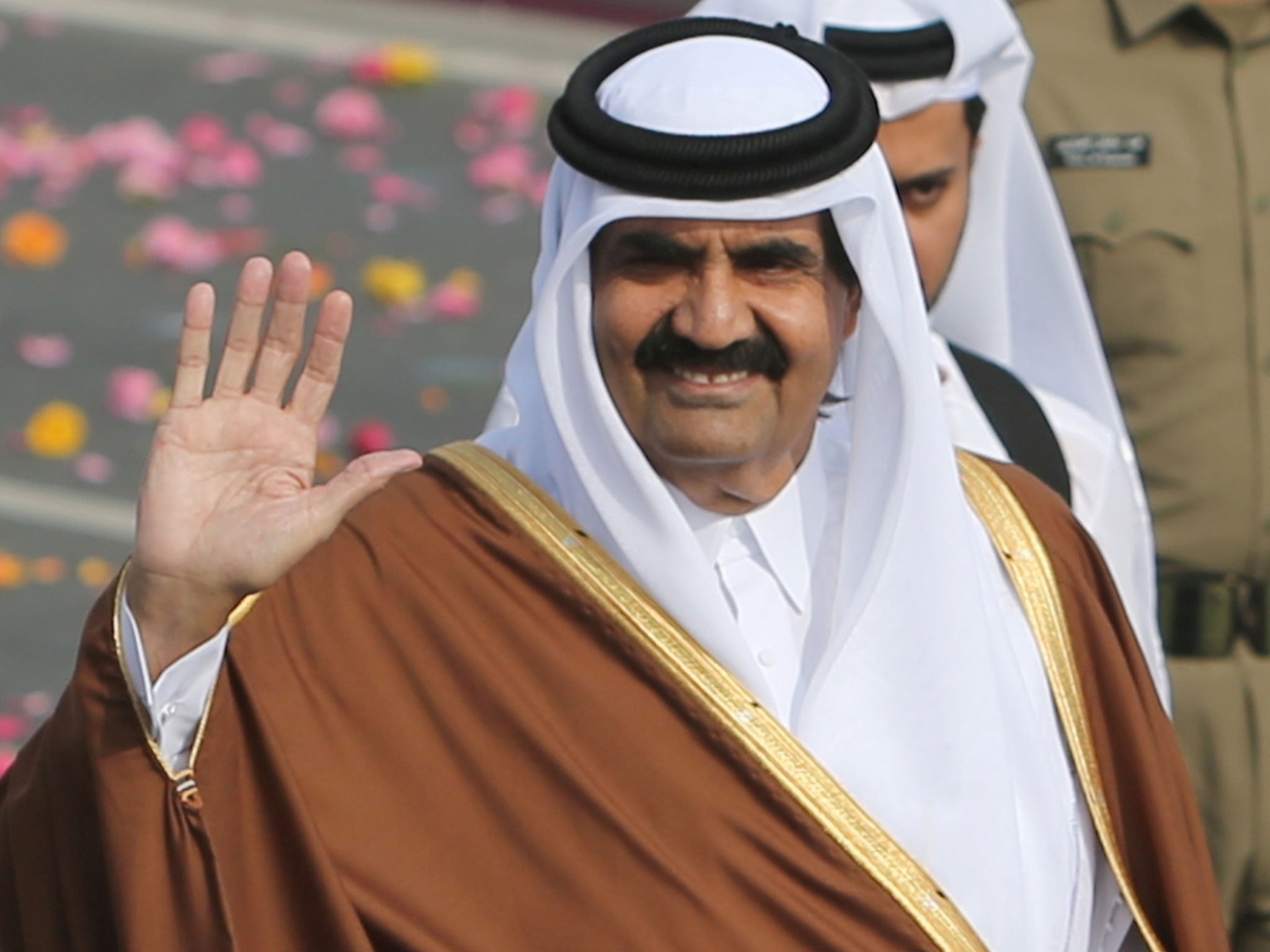 Qatari Emir Sheikh Hamad bin Khalifa al-Thani arrives to attend the Gulf emirate's National Day celebrations in Doha on December 18, 2012.