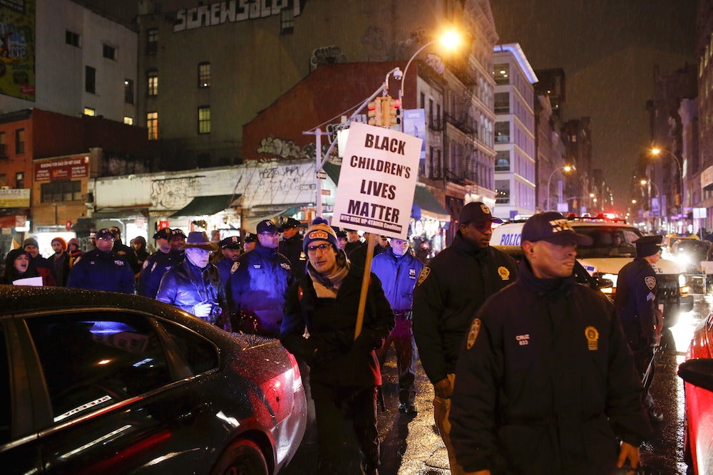 Protesters demonstrate in New York City after the decision to clear two officers in the fatal police shooting of 12-year-old Tamir Rice.