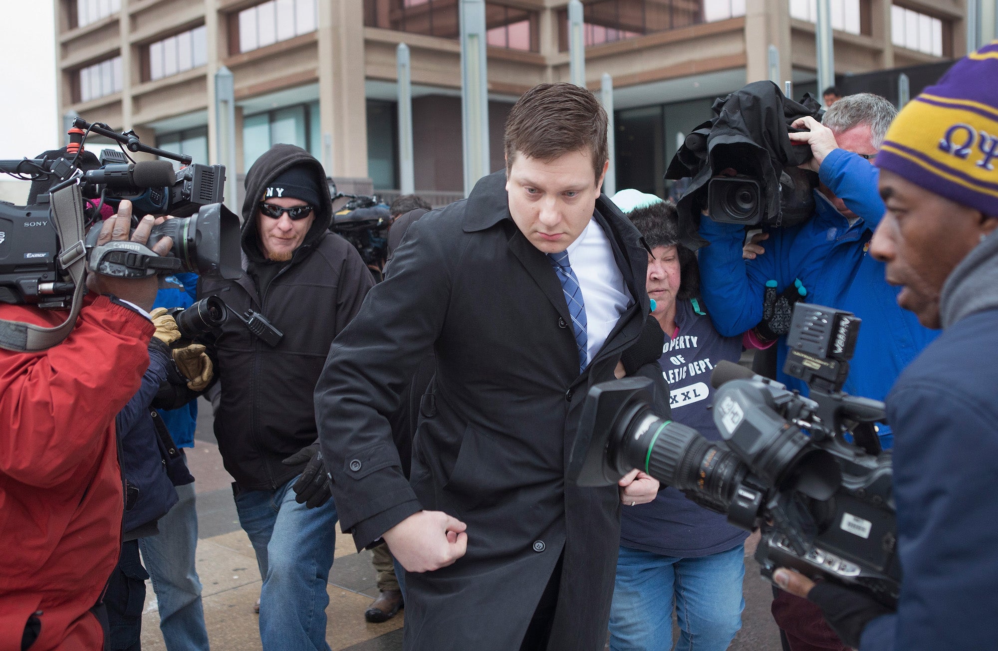 Chicago police officer Jason Van Dyke leaves the Criminal Courts Building in Chicago, Illinois on December 29, 2015, after pleading not guilty to first-degree murder charges related to the shooting death of 17-year-old Laquan McDonald.