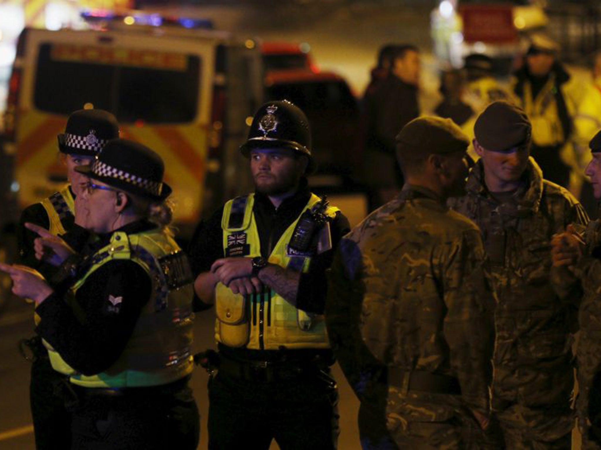 Emergency services personnel at the scene of a collapsed road bridge in Tadcaster